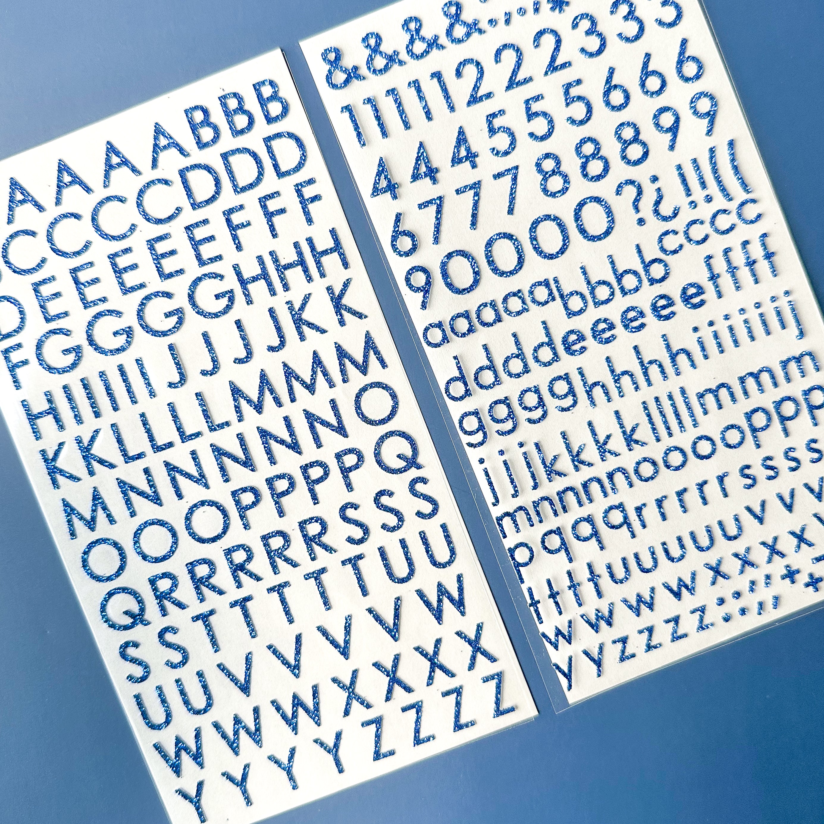 Add sparkle to your crafts with our glitter blue color letter stickers, featuring a shimmering assortment of letters in a vibrant spectrum of colors. These sticker sheets are sold at BBB Supplies Craft Shop.