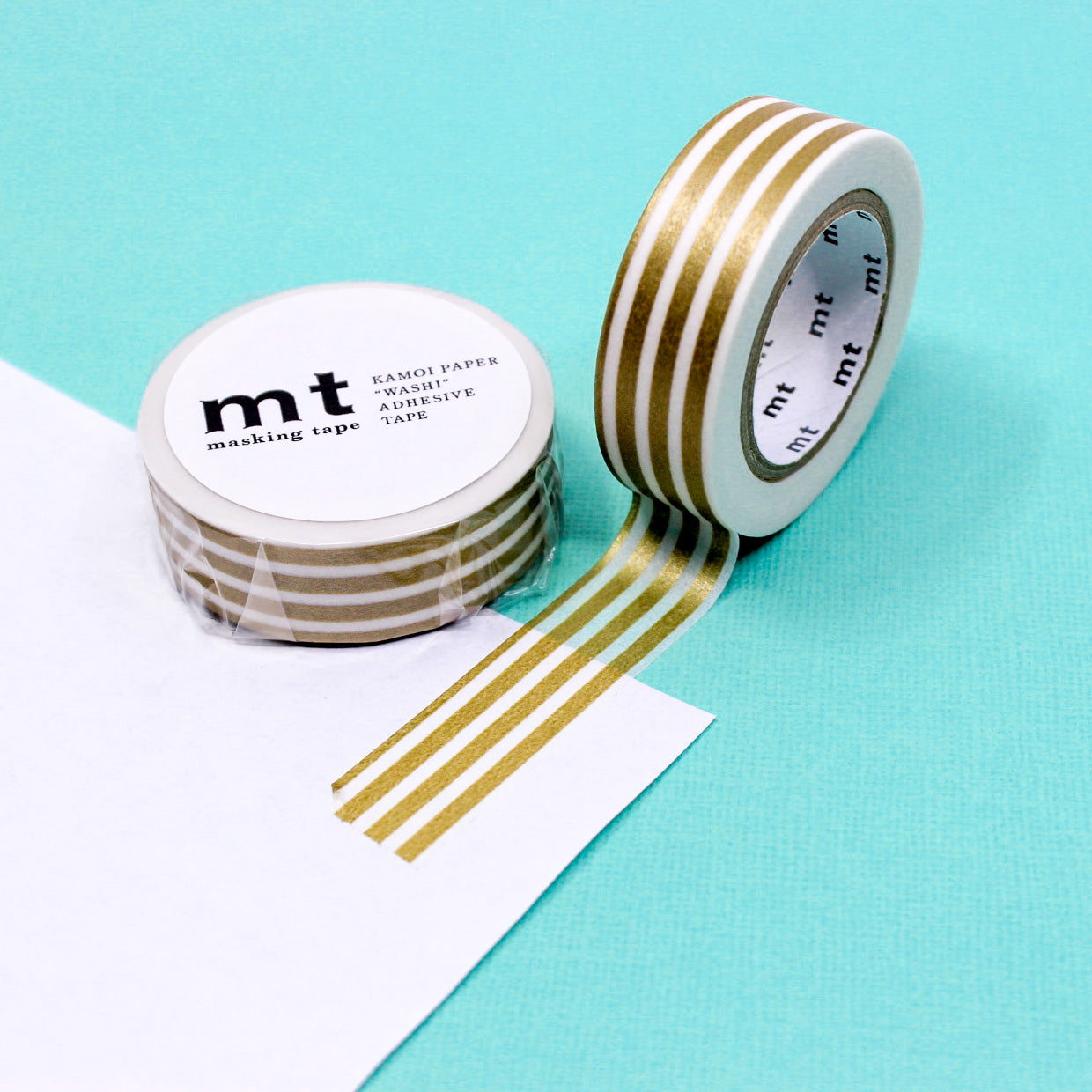 Enhance your crafts with our thicker line horizontal stripe washi tape, featuring bold and stylish stripes in a variety of colors, perfect for adding a dynamic and vibrant element to your projects. This Gold Stripe tape is from MT Brand Masking Tape and sold at BBB Supplies Craft Shop.