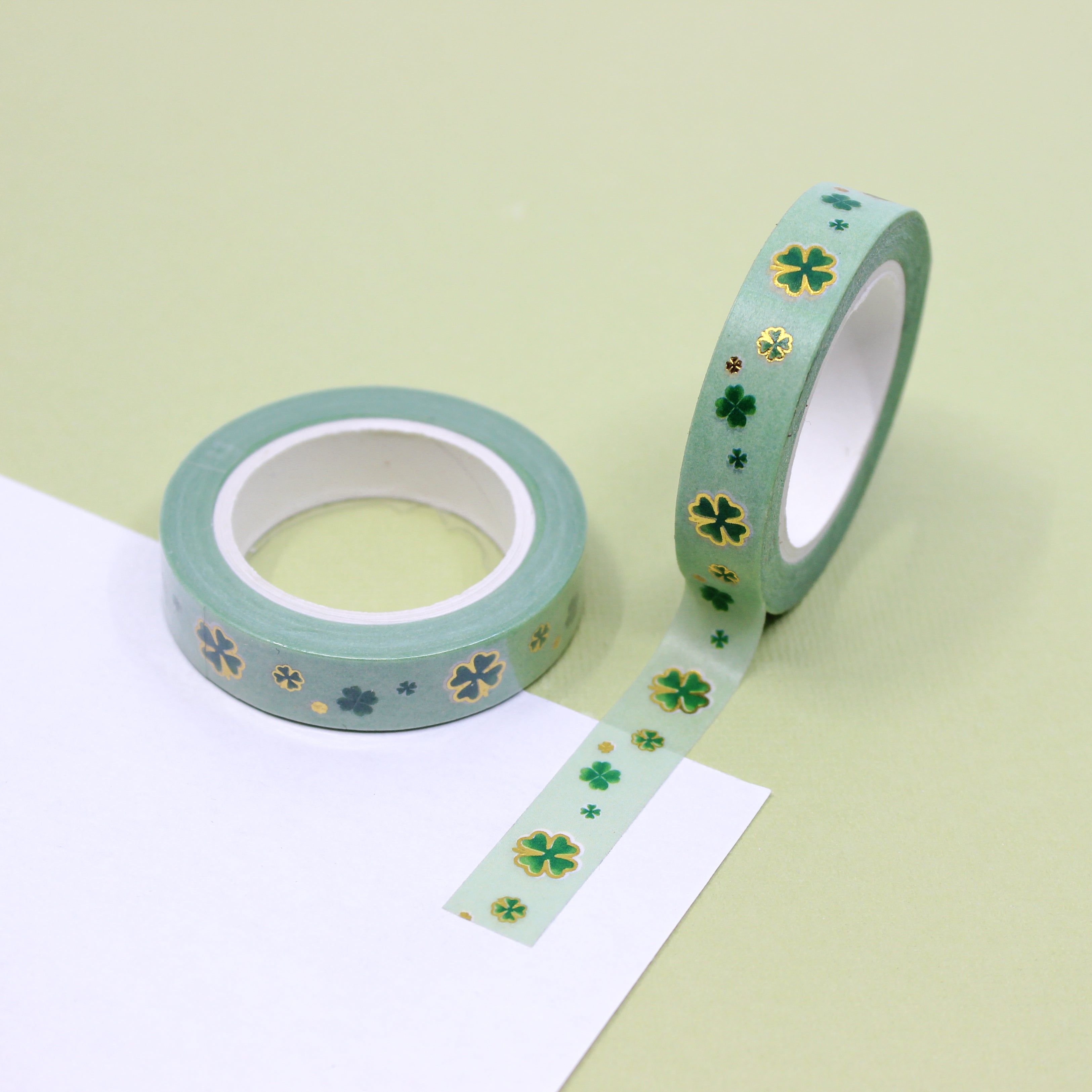 Green & Gold Foil Clover Washi Tape: Celebrate St. Patrick's Day or add a touch of luck to your projects with this charming washi tape featuring a pattern of green clovers accented with gold foil. Ideal for crafts, cards, and decor. This tape is sold at BBB Supplies craft Shop.