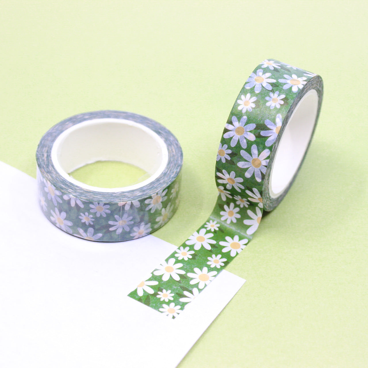 Green Daisy Flower Washi Tape: This washi tape features a beautiful green daisy flower pattern, adding a touch of nature's beauty to your crafts and projects. This tape is sold at BBB Supplies Craft Shop.