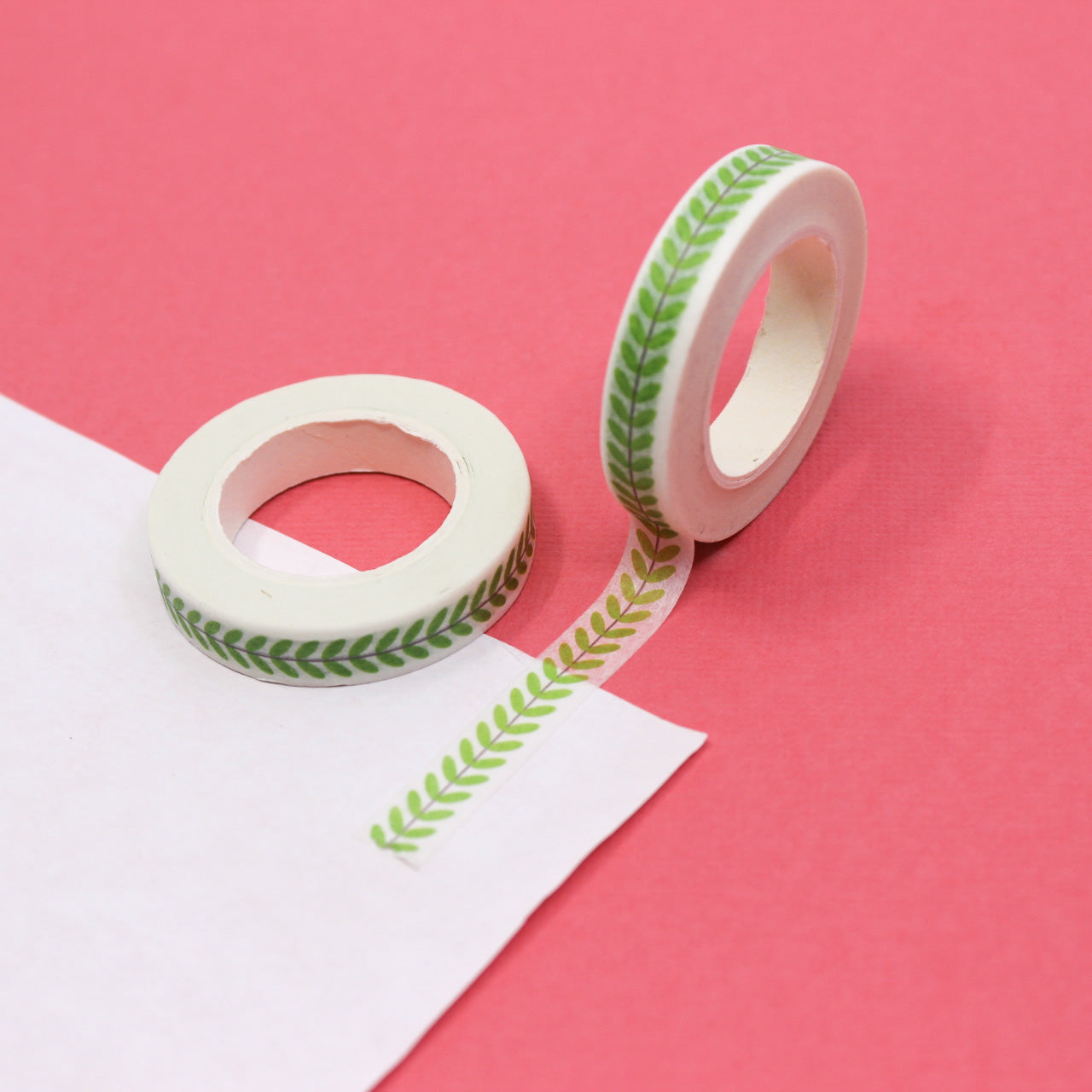 Embrace the beauty of nature with our Narrow Green Vine Washi Tape, featuring delicate vine and leaf patterns in a lush green hue. Ideal for adding a touch of botanical charm to your crafts. This tape is sold at BBB Supplies Craft Shop.