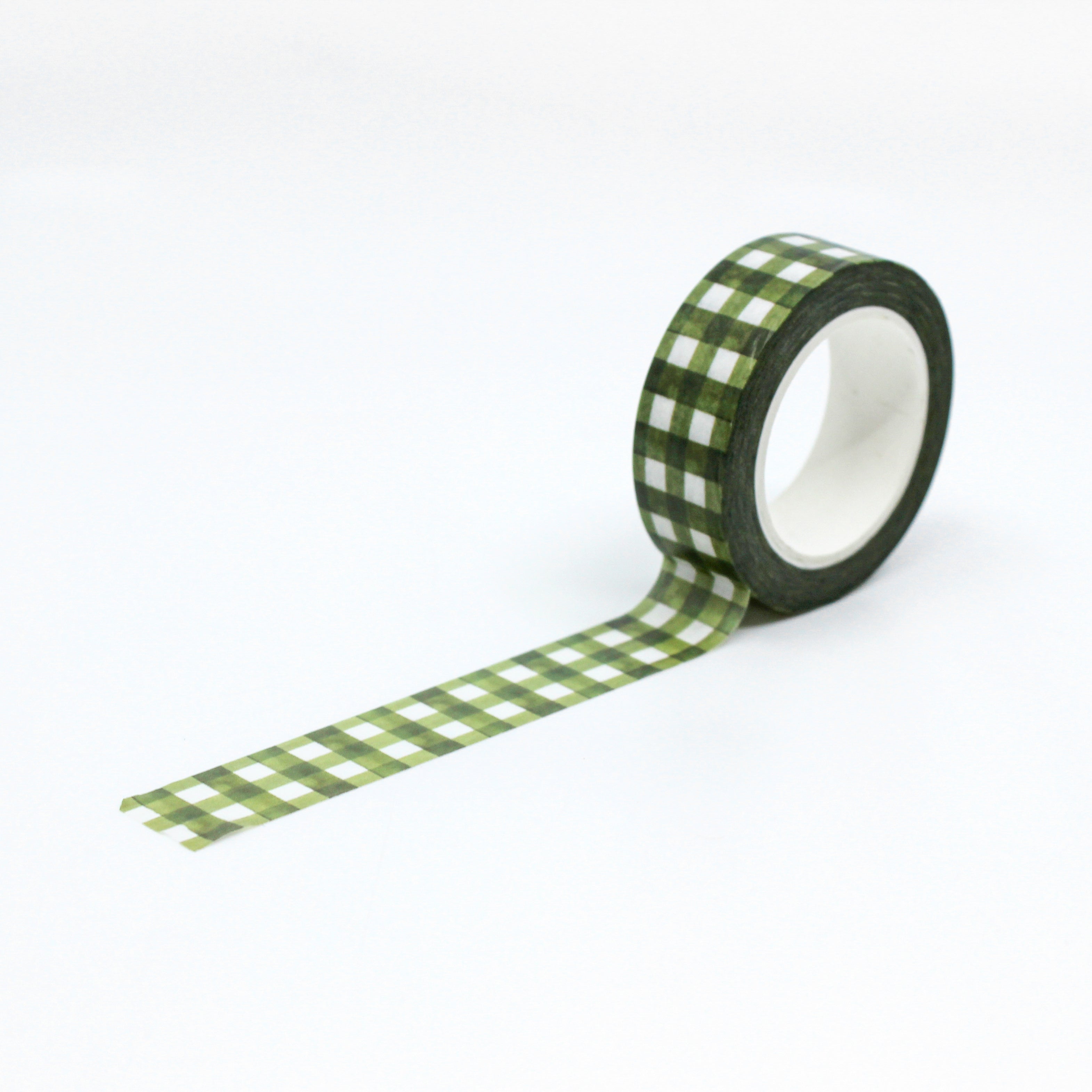 Green Spring Plaid Washi Tape: Add a touch of spring to your crafts with our Green Plaid Washi Tape. Featuring a fresh green color and classic plaid pattern, this tape is perfect for adding a cheerful accent to your projects. Ideal for scrapbooking, card making, journaling, and more, this versatile tape is a must-have for any crafter.  This tape is sold at BBB Supplies Craft Shop.