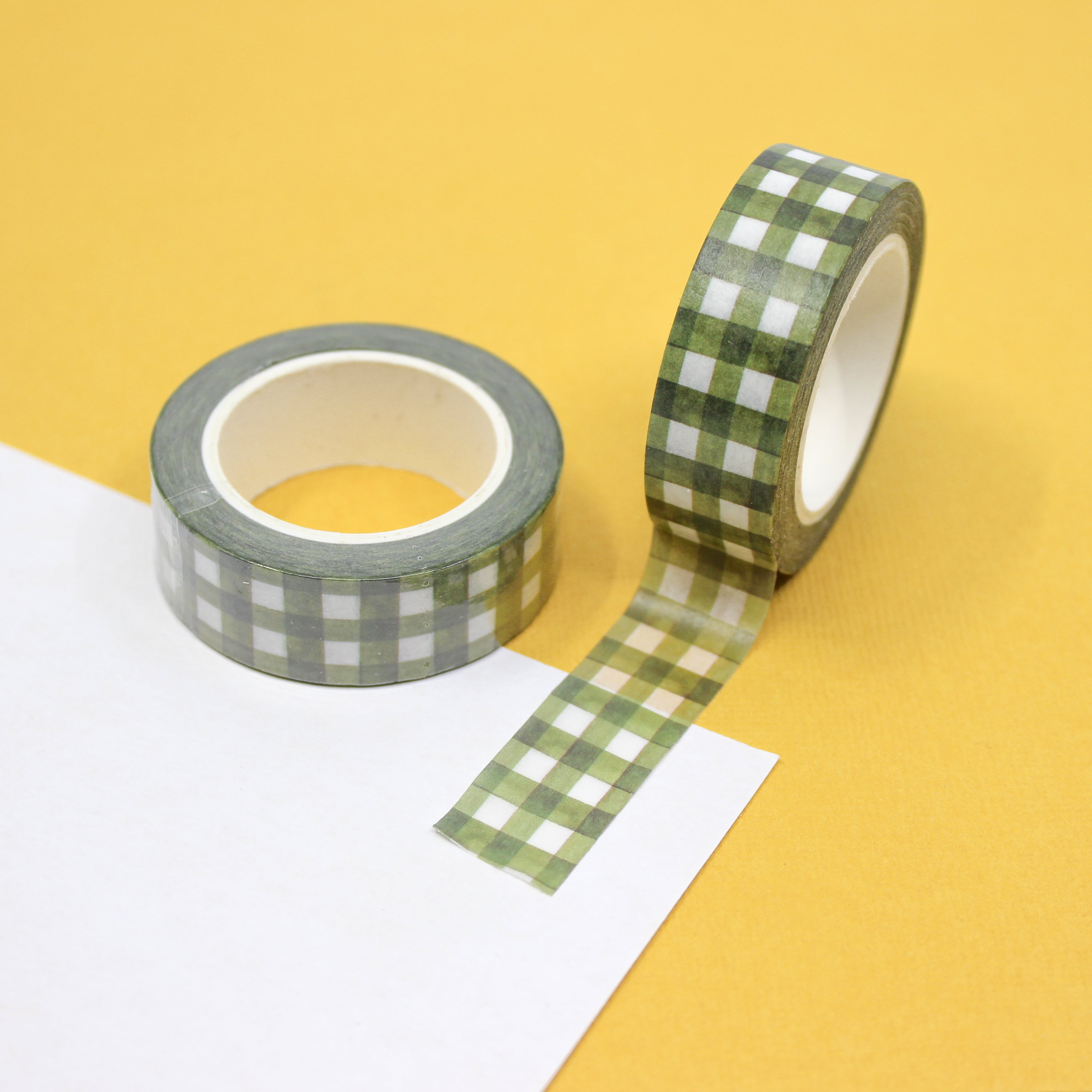 Green Spring Plaid Washi Tape: Add a touch of spring to your crafts with our Green Plaid Washi Tape. Featuring a fresh green color and classic plaid pattern, this tape is perfect for adding a cheerful accent to your projects. Ideal for scrapbooking, card making, journaling, and more, this versatile tape is a must-have for any crafter.  This tape is sold at BBB Supplies Craft Shop.