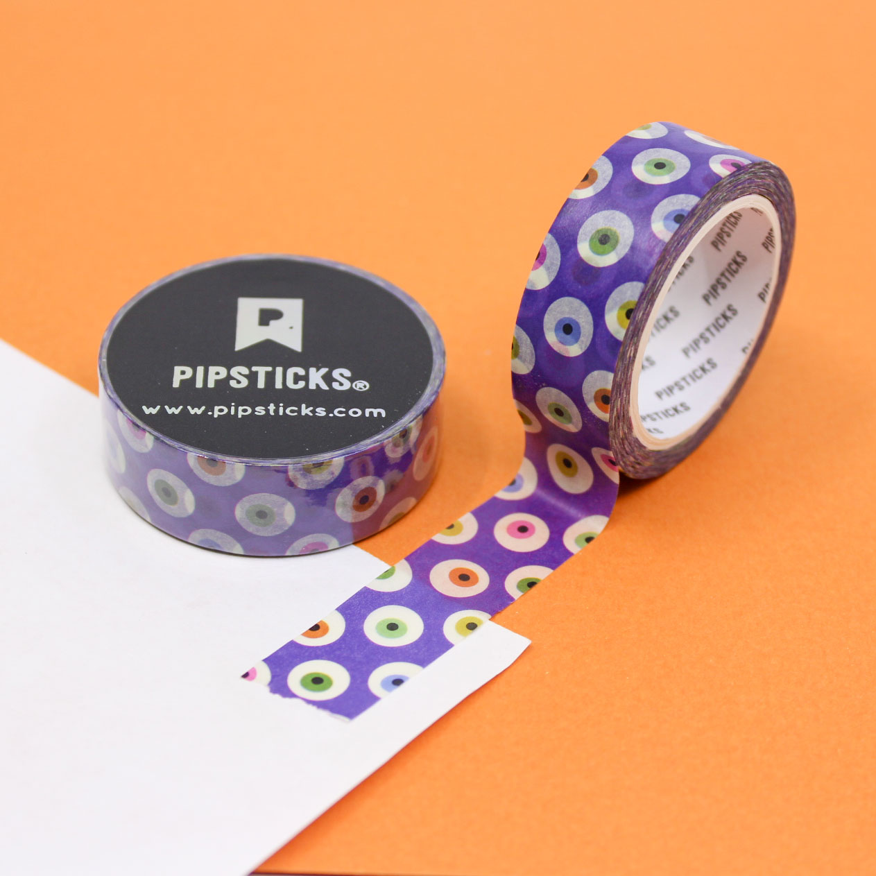 Purple Monster Eyes Washi Tape with quirky monster eyes on a bold purple background, perfect for Halloween crafts, planners, and spooky-themed projects.