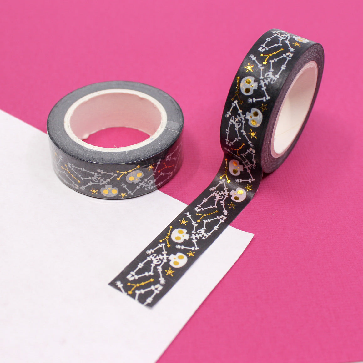 Embrace the macabre with our Gold Foil Skull and Bones Washi Tape, featuring a stylish pattern of skulls and bones in shimmering gold foil. Ideal for adding a touch of elegance to your spooky projects. This tape is sold at BBB Supplies craft Shop.