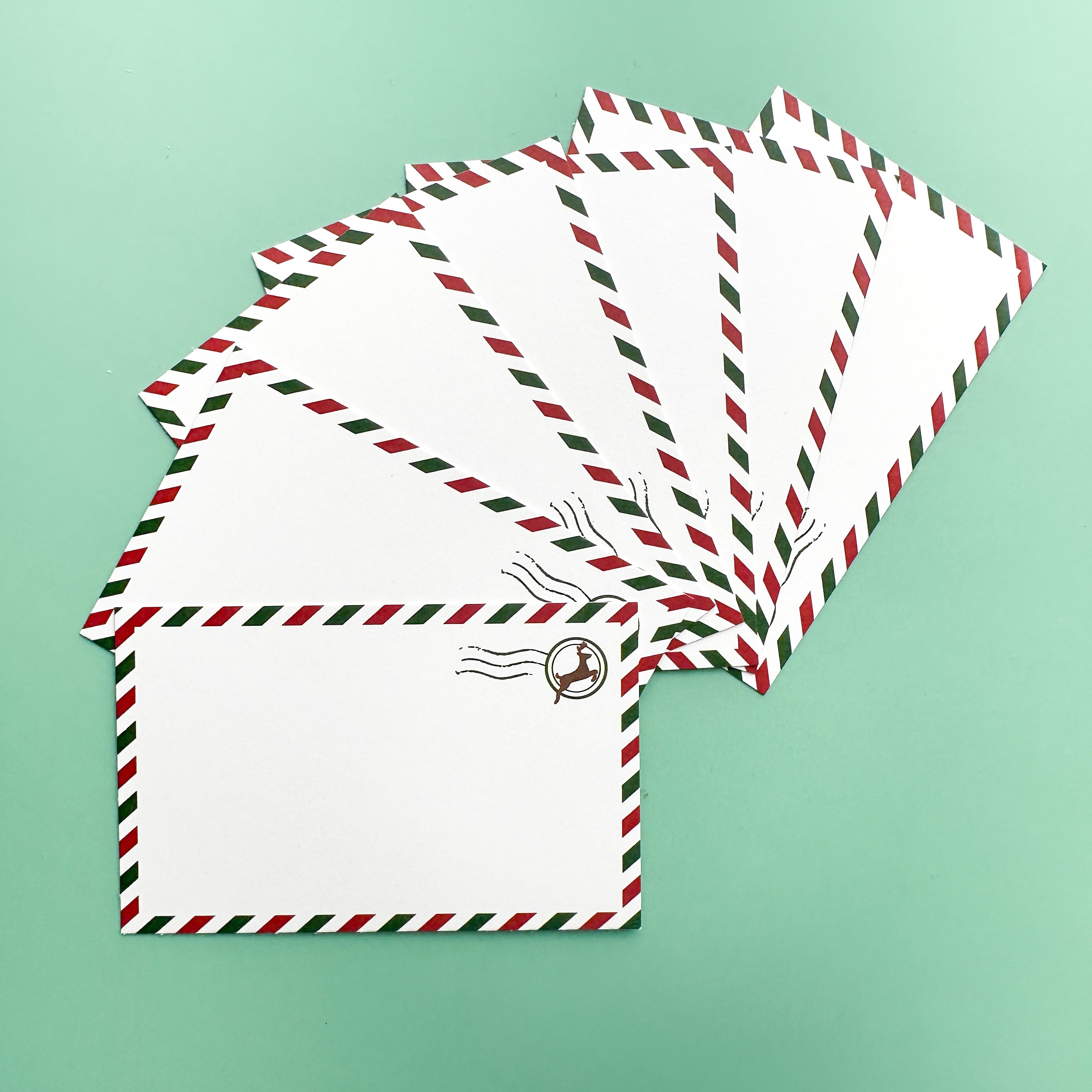 Holiday Airmail Style Mini Notecards featuring vintage airmail stripes and festive holiday motifs, perfect for sending holiday greetings, gift tags, or personal messages.