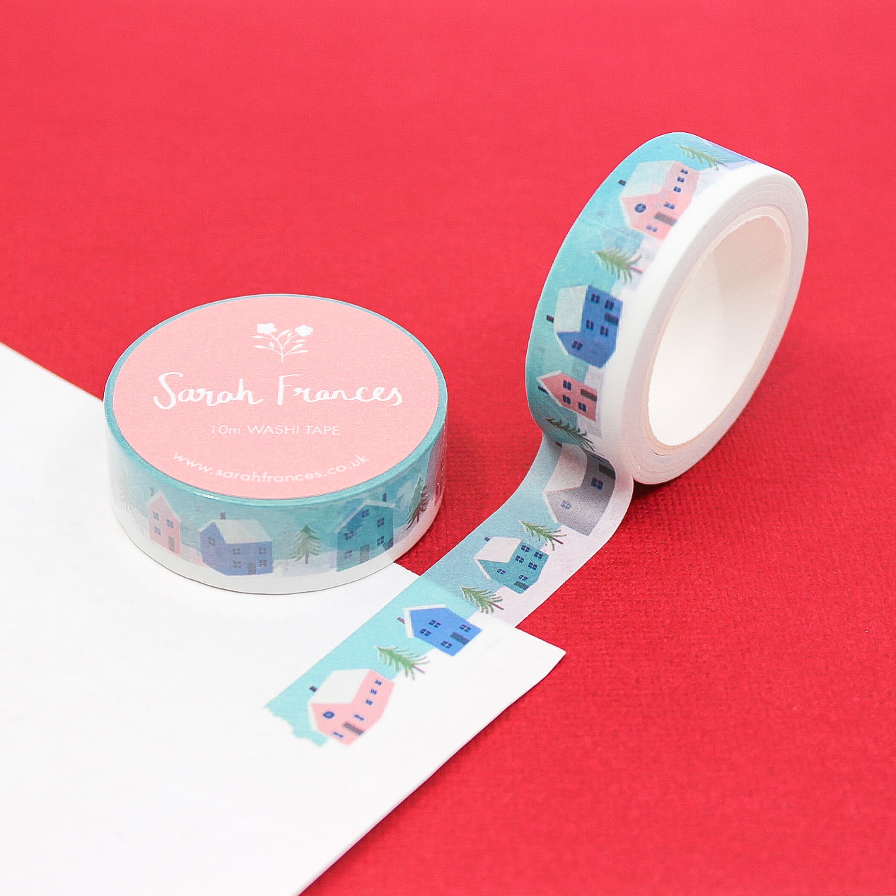 Holiday Village Washi Tape with pink and blue buildings on snowy background