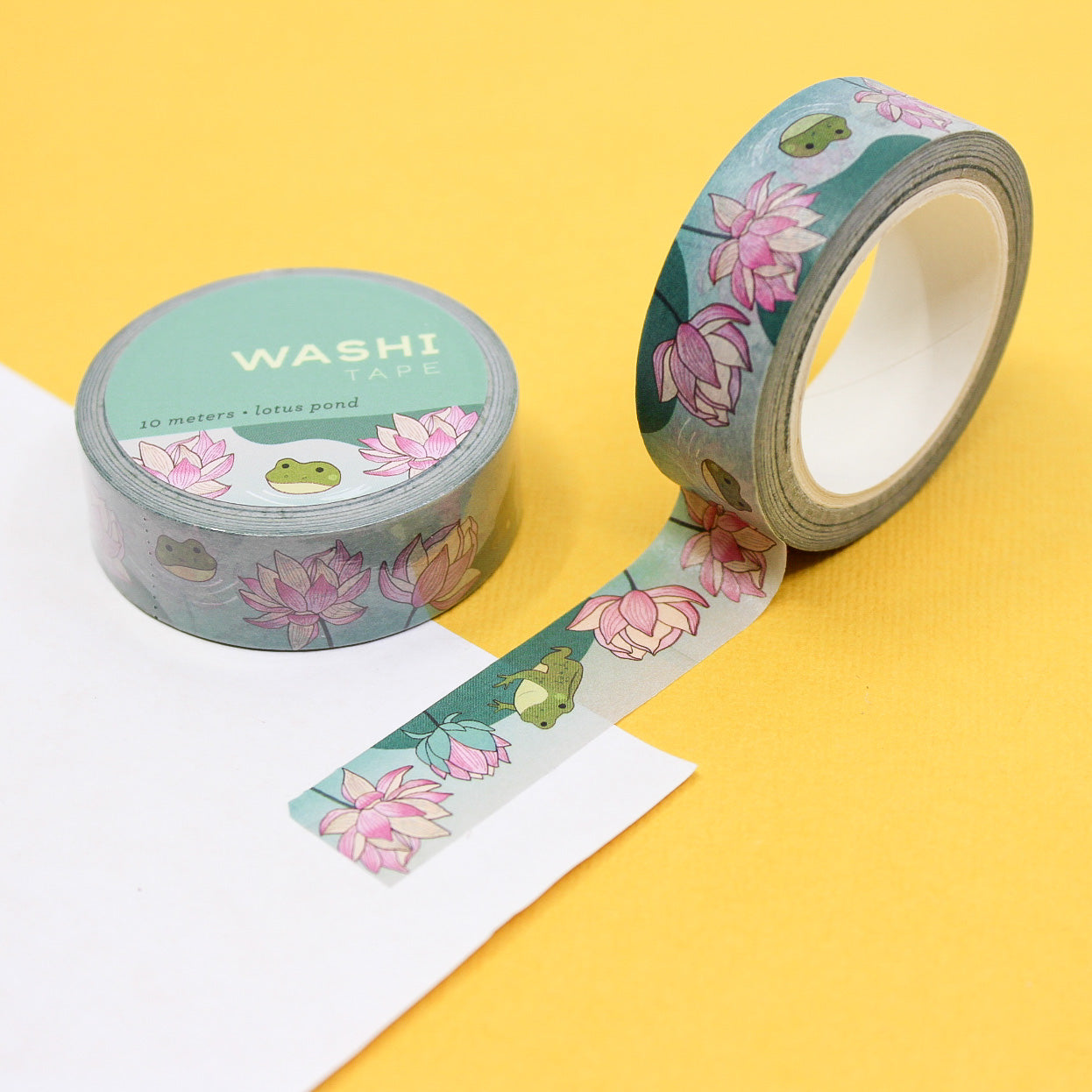 Lotus Flower and Frog Washi Tape featuring delicate lotus flowers and playful frogs, adding a serene and whimsical touch to your crafts and projects. This tape is from Girl of All Work and sold at BBB Supplies Craft Shop.