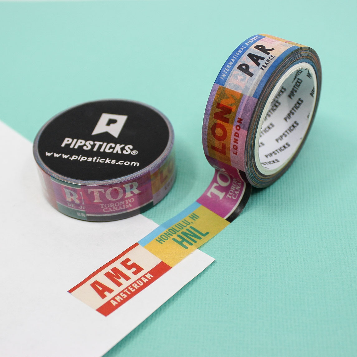 Decorate your travel-themed crafts with this washi tape featuring colorful luggage tags from various destinations, ideal for planners, scrapbooks, and journals. This tape is from Pipsticks and sold at BBB Supplies Craft Shop.