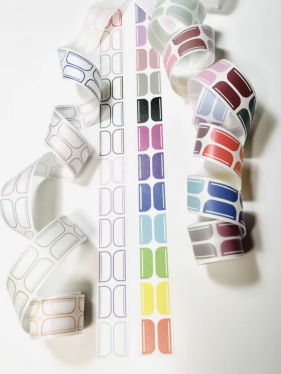 Set of colorful label rolls to make your own tab on a white background