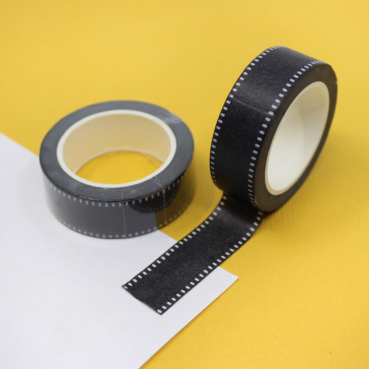 Enhance your creations with our captivating black faux grosgrain ribbon washi tape, showcasing a chic ribbon-like pattern that brings a sense of style and refinement to your crafts. This tape is sold at BBB Supplies Craft Shop.