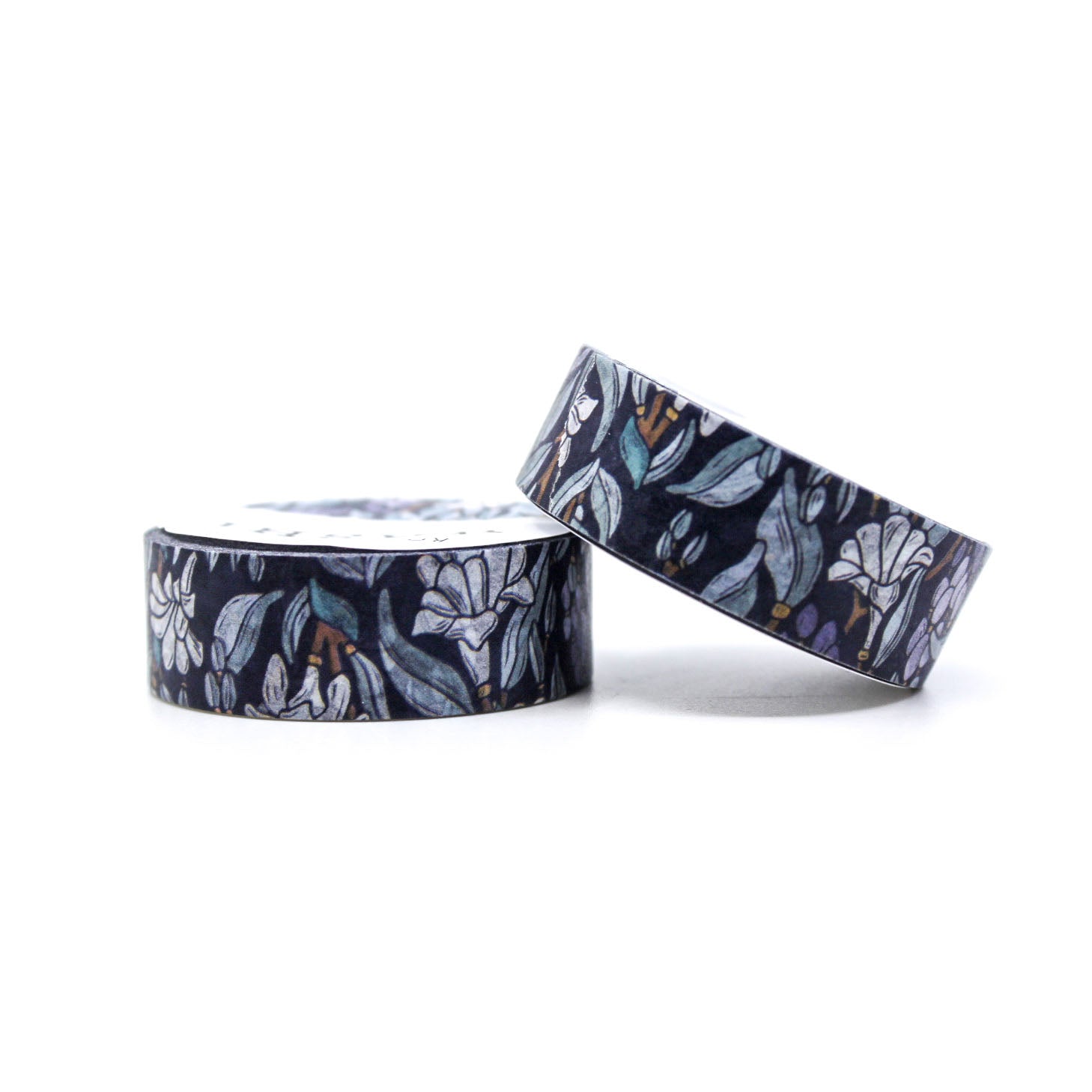 This blue Moonlight Tuberose Floral Washi Tape brings a dreamy, serene vibe to your crafts with its delicate depiction of tuberose blooms under a soft blue moonlit sky. The intricate floral design paired with deep blue hues evokes a sense of calm and elegance, making it perfect for enhancing journals, planners, or DIY projects