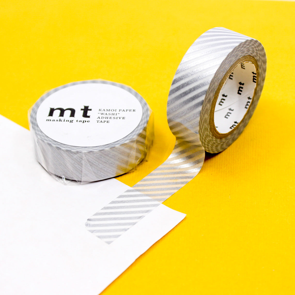 Infuse your projects with the appeal of clean lines using our washi tape, adorned with narrow diagonal stripes that add a subtle and stylish element to your crafts. This silver Diagonal Striped Washi tape is from MT Brand Washi and sold at BBB Supplies Craft Shop.