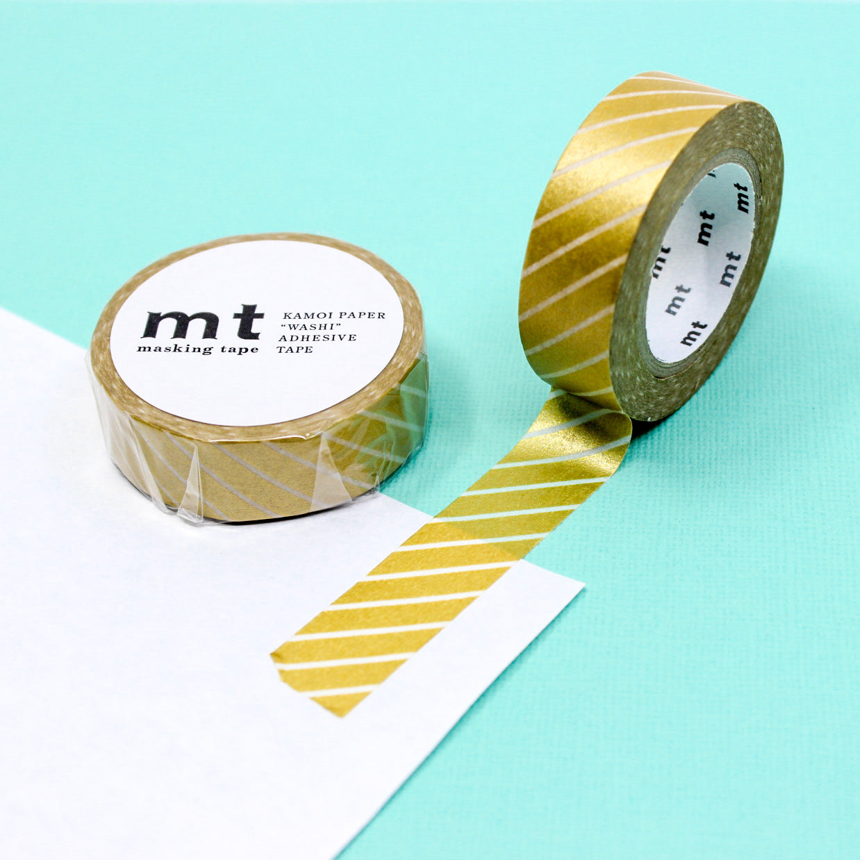 Infuse your projects with the appeal of clean lines using our washi tape, adorned with narrow diagonal stripes that add a subtle and stylish element to your crafts. This gold Diagonal Striped Washi tape is from MT Brand Washi and sold at BBB Supplies Craft Shop.