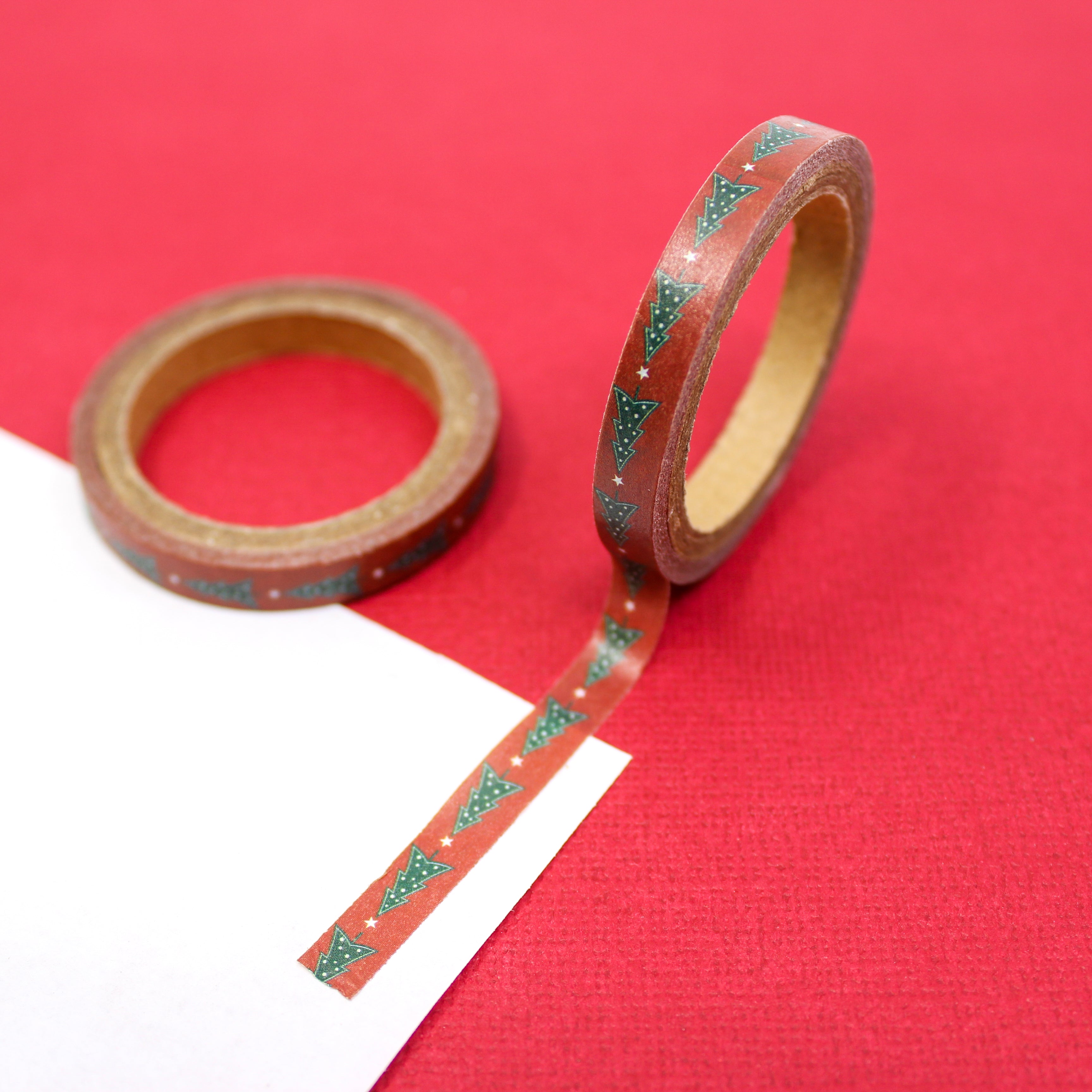 Celebrate the festive season with our red Christmas tree washi tape, featuring charming Christmas tree designs in a vibrant red hue, perfect for adding a touch of holiday spirit to your crafts. This tape is sold at BBB Supplies Craft Shop.