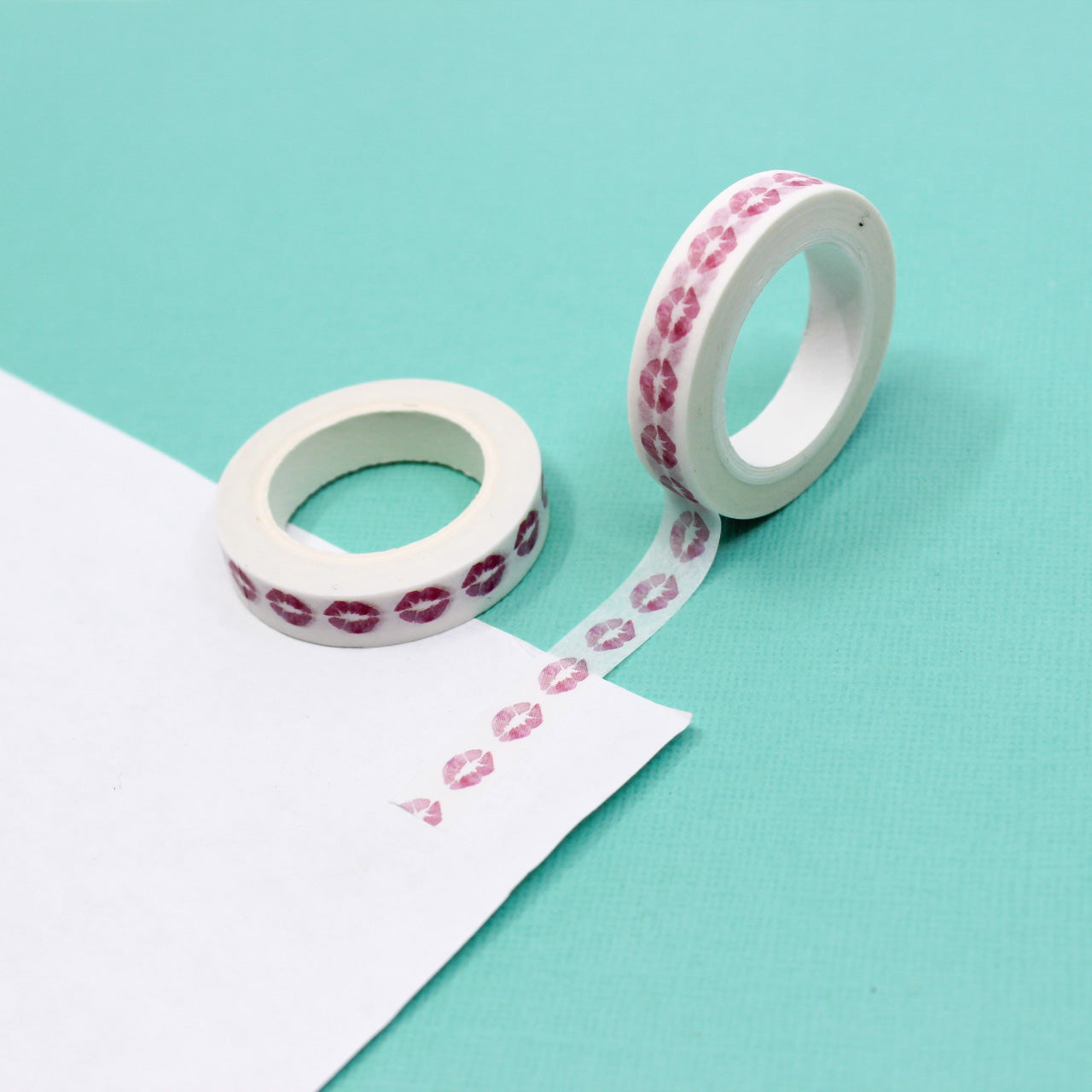 Make a stylish statement with our Pink Lipstick Lips Washi Tape, adorned with a playful lipstick kiss pattern. Ideal for adding a touch of glamour and sass to your projects. This tape is sold at BBB Supplies Craft Shop.