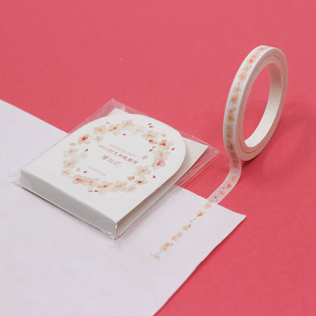 Add a touch of floral elegance to your projects with our Narrow Pink Flowers Border Washi Tape, adorned with delicate pink flower patterns. Ideal for bringing a hint of natural beauty to your crafts. This tape is sold at BBB Supplies Craft Shop.
