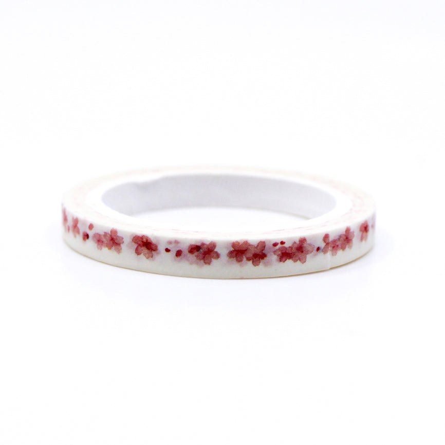 Add a touch of floral elegance to your projects with our Narrow Pink Flowers Border Washi Tape, adorned with delicate pink flower patterns. Ideal for bringing a hint of natural beauty to your crafts. This tape is sold at BBB Supplies Craft Shop.