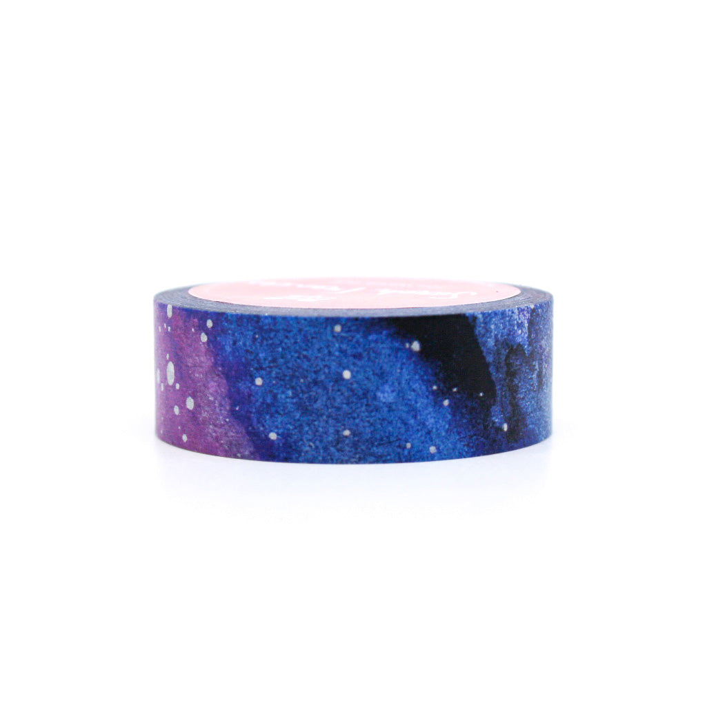 This washi tape is a purple and blue galaxy night sky with stars. It is from Sarah Frances Designs and sold at BBB Supplies Craft Shop.