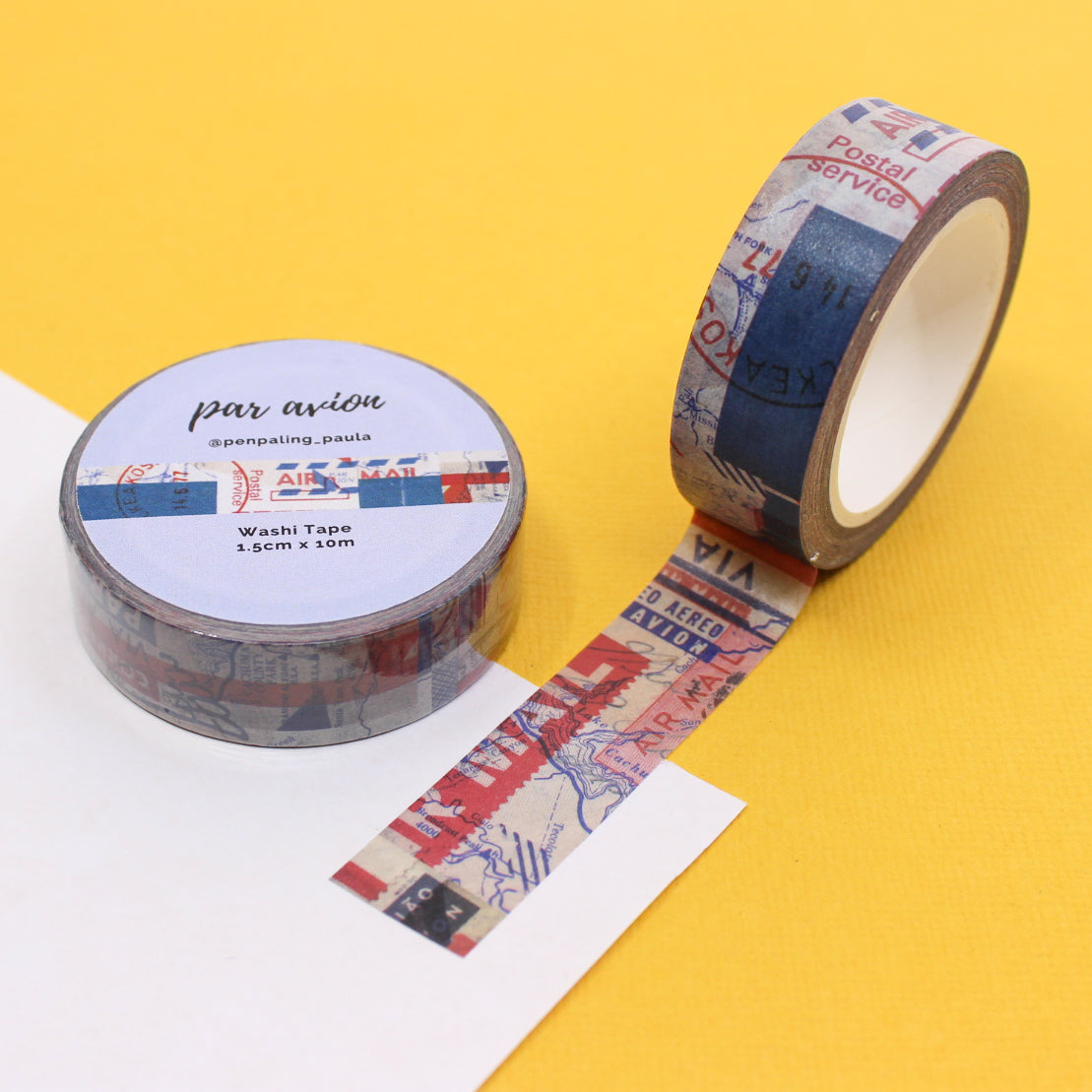 "Par Avion Air Mail Washi Tape" features classic red and blue airmail stripes with elegant 'Par Avion' text, adding a vintage, international flair to your letters, journals, planners, and craft projects. Perfect for mail art enthusiasts and those who love timeless, travel-inspired designs.
