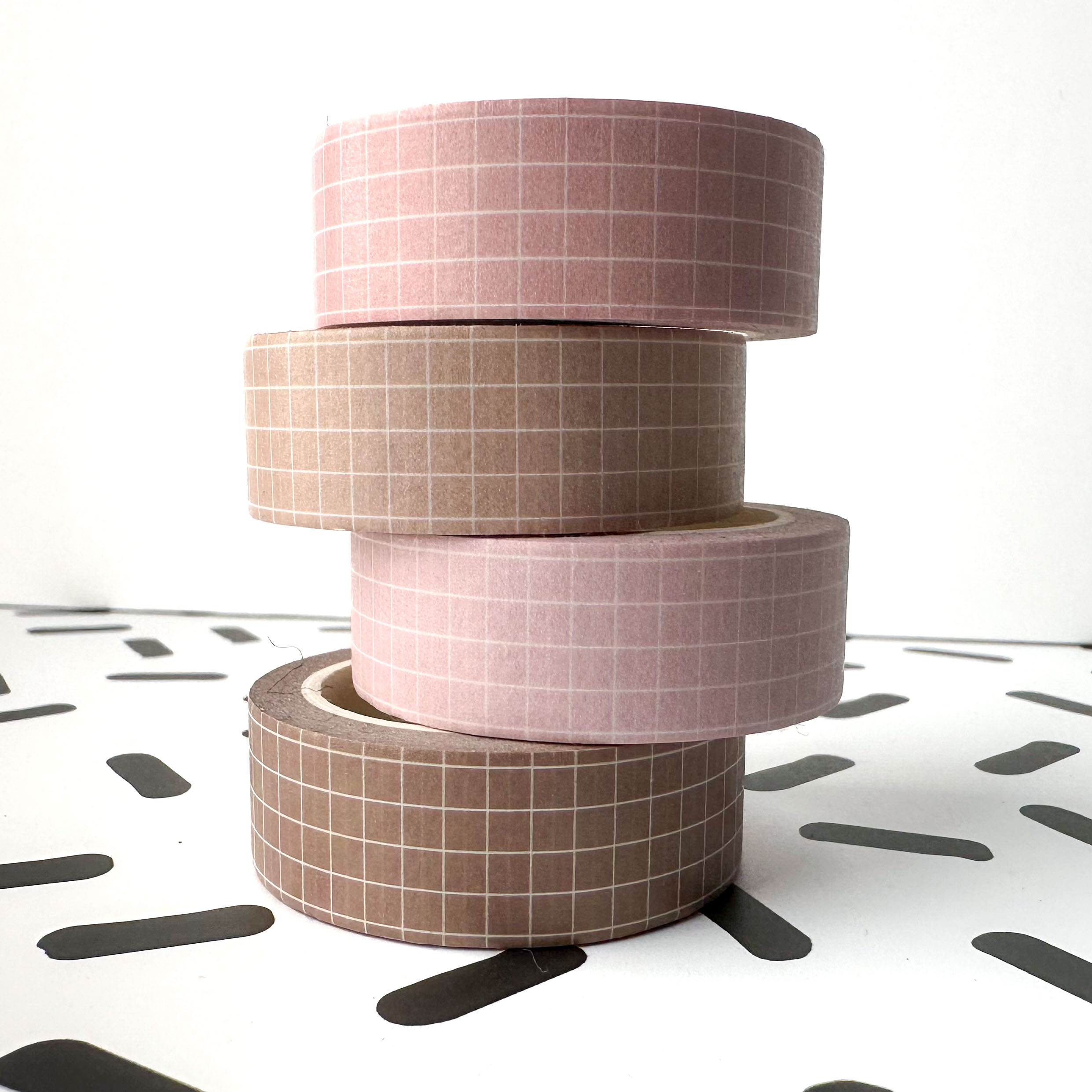 Soft neutrals grid washi tape in shades of soft pink, blush, light tan, and brown, featuring a minimalist grid pattern perfect for elegant and organized crafts.