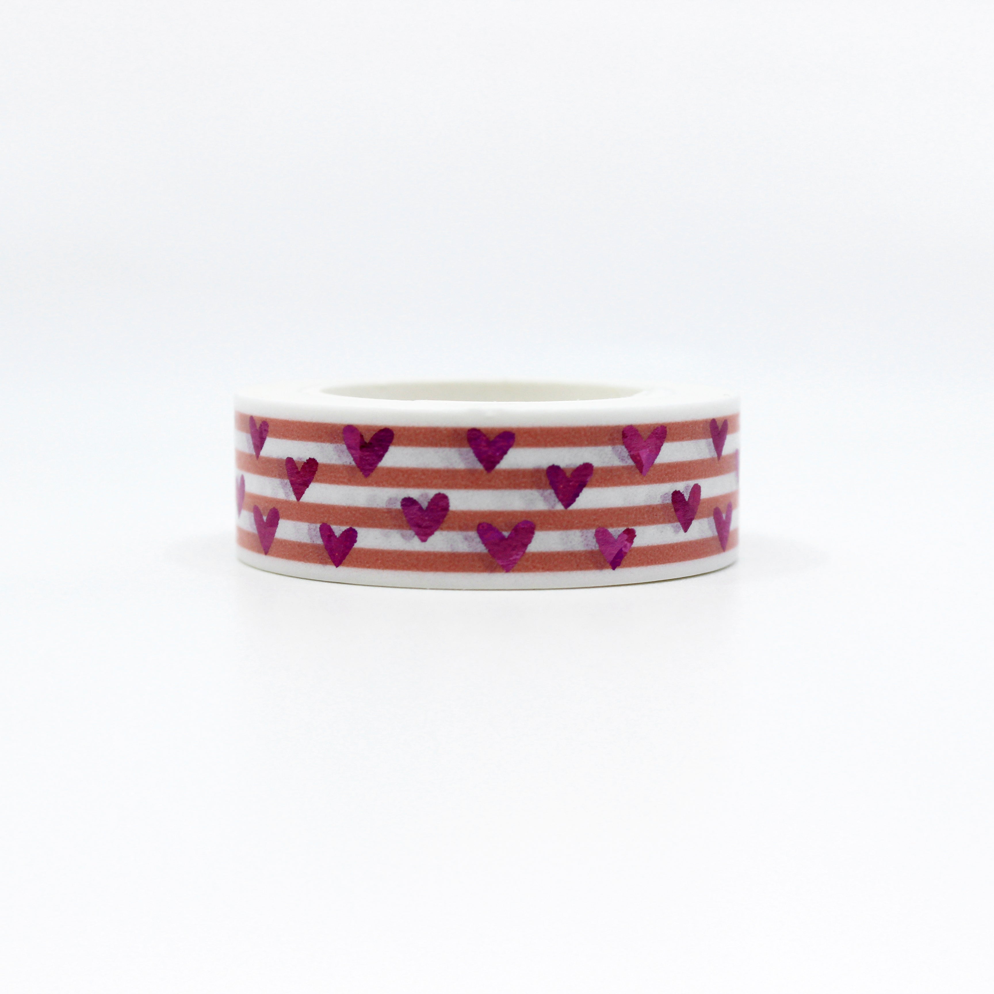 This vibrant pink foil heart washi tape features a narrow pink stripe as a backdrop making it a colorful but elegant choice for your valentines spreads, craft projects, and BUJO layouts. This tape is sold at BBB Supplies craft shop.