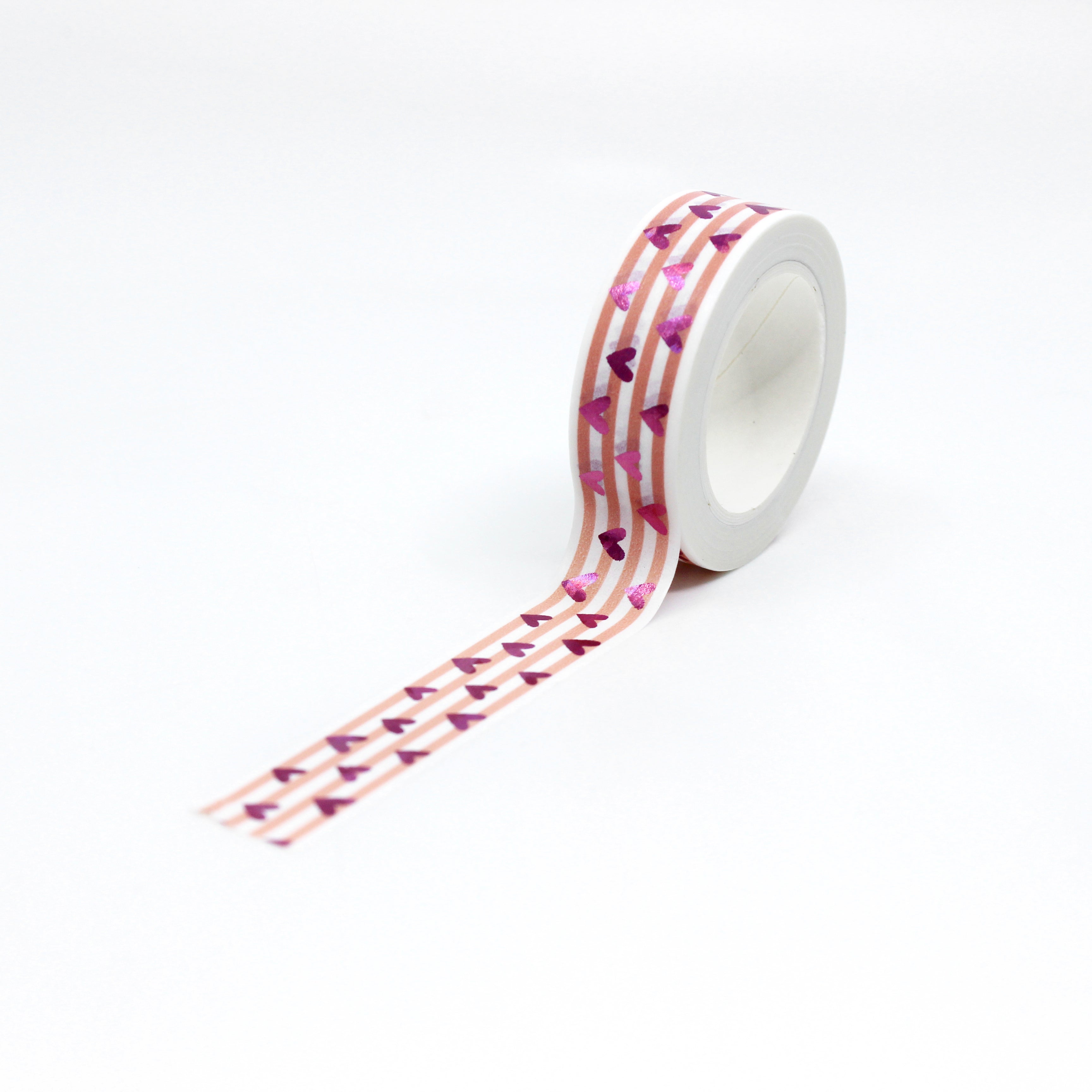 This vibrant pink foil heart washi tape features a narrow pink stripe as a backdrop making it a colorful but elegant choice for your valentines spreads, craft projects, and BUJO layouts. This tape is sold at BBB Supplies craft shop.