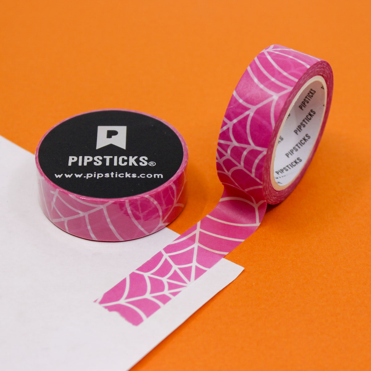Pink Tangled Web Washi Tape with black spider webs on a soft pink background, perfect for Halloween crafts, planners, and spooky-themed decor.