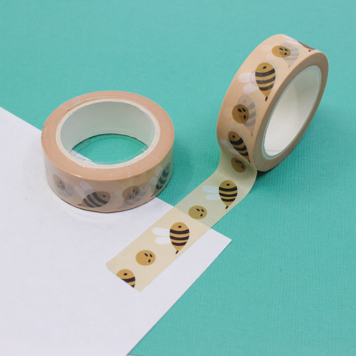 This vibrant washi tape features a playful pattern of colorful bees, perfect for adding a cheerful touch to your crafts, scrapbooking, or journaling projects. This tape is sold at BBB Supplies Craft Shop.