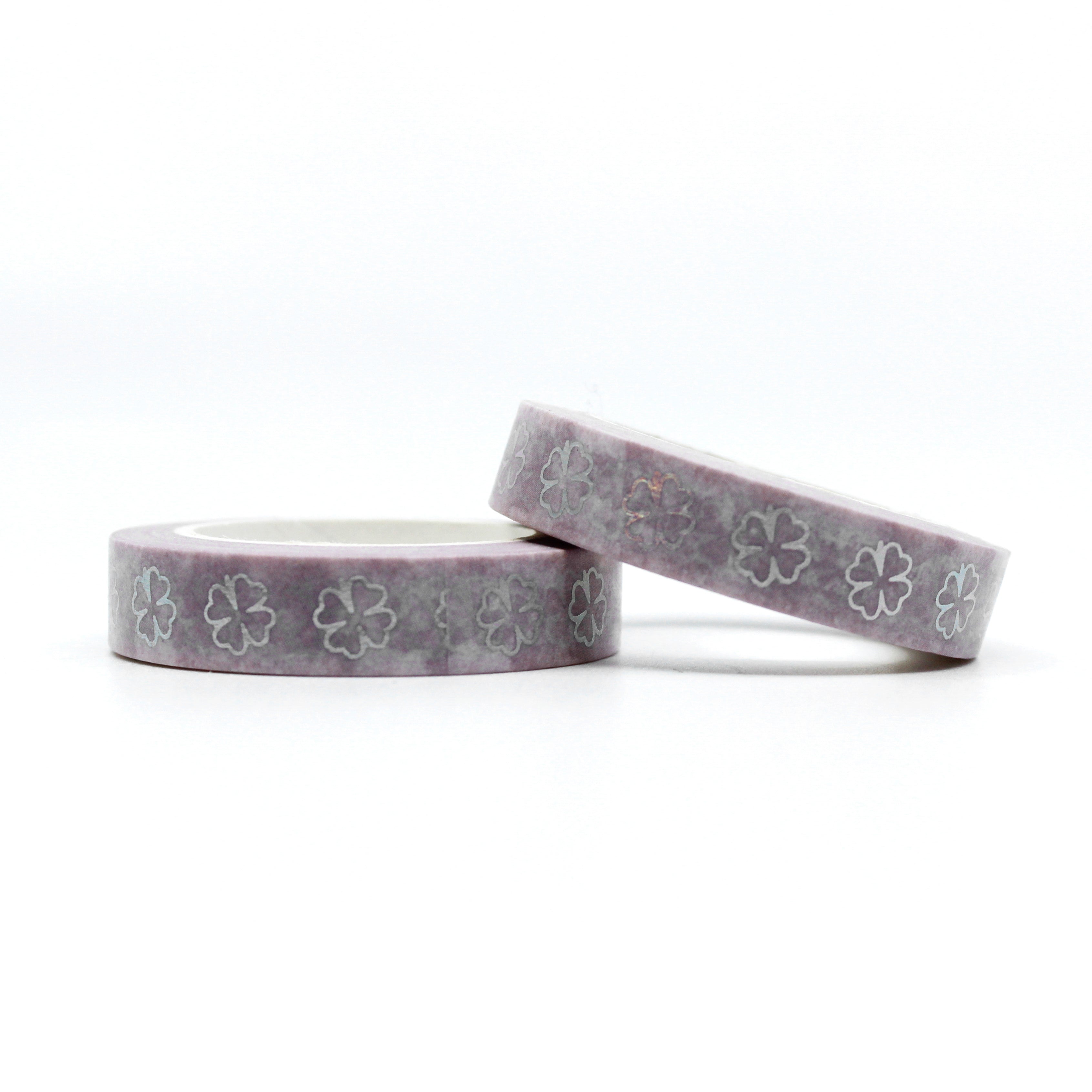 Purple & Silver Foil Clover Washi Tape: Add a touch of elegance and luck to your projects with this washi tape featuring a pattern of purple clovers accented with silver foil. Perfect for St. Patrick's Day or any project that needs a bit of charm. This tape is sold at BBB Supplies Craft Shop.