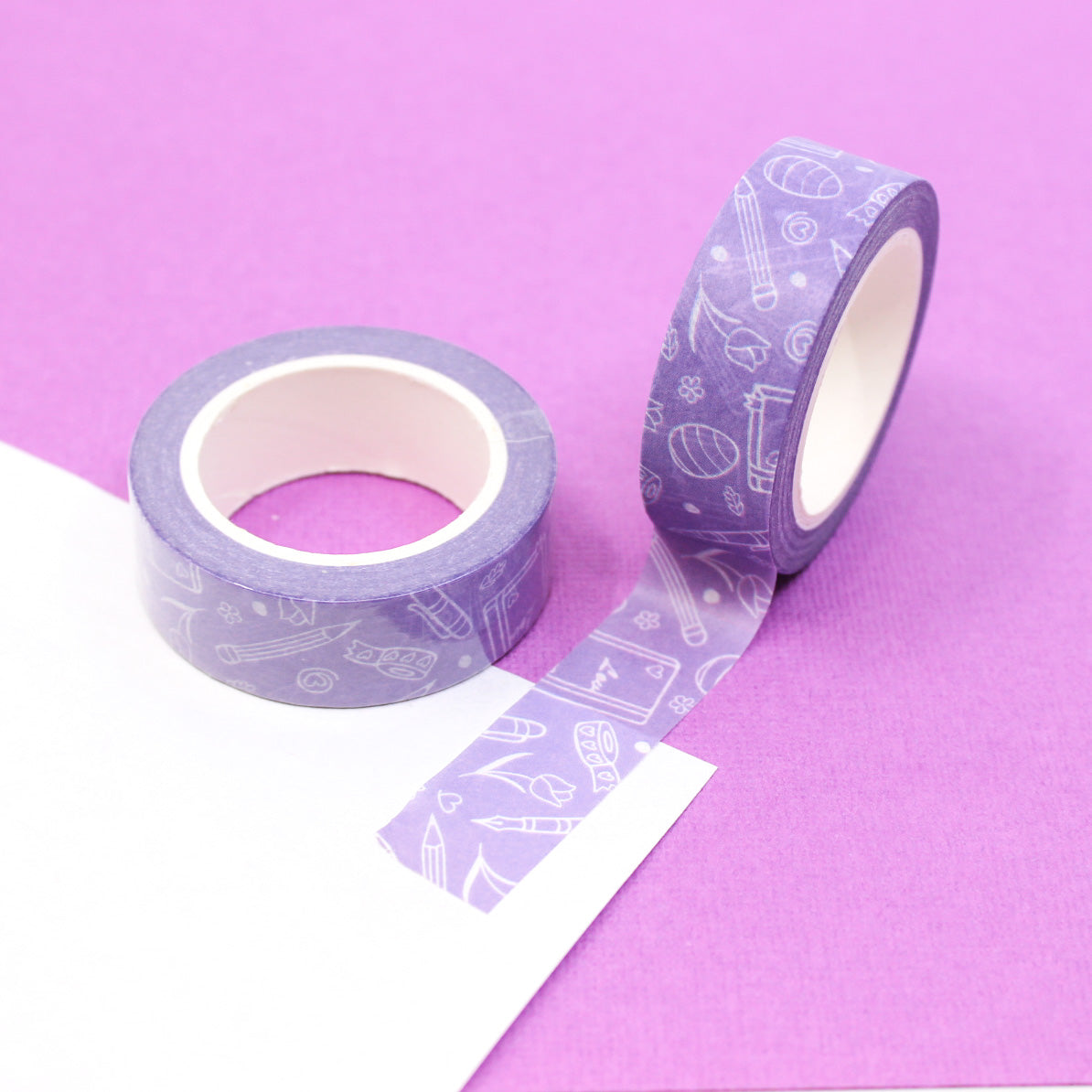 Purple Spring Planner Objects Washi Tape: This washi tape features various spring-themed planner objects in shades of purple, perfect for adding a touch of spring to your planner or journal. This tape is sold at BBB Supplies Craft Shop.