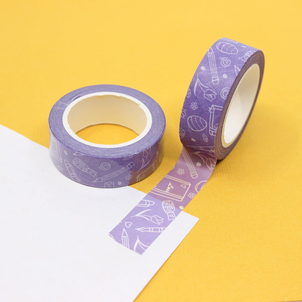 Purple Spring Planner Objects Washi Tape: This washi tape features various spring-themed planner objects in shades of purple, perfect for adding a touch of spring to your planner or journal. This tape is sold at BBB Supplies Craft Shop.