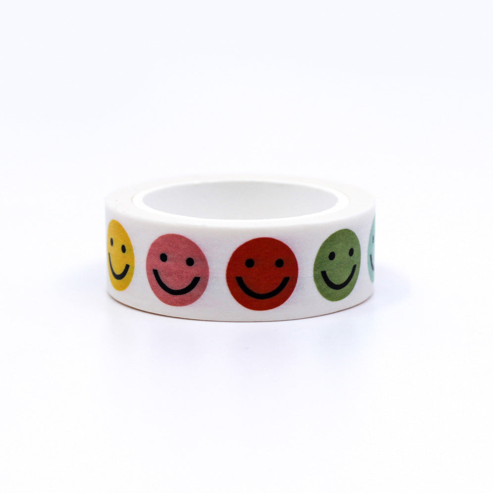Vibrant Rainbow Colors Smiley Face Washi Tape, featuring cheerful expressions on a colorful background, adding a playful touch to your creative projects. This tape is from Worthwhile Papers and sold at BBB Supplies Craft Shop.