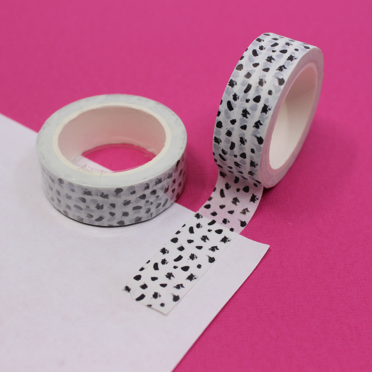 Add a touch of contemporary flair to your projects with this washi tape featuring a modern abstract black and white dots design. Perfect for adding a stylish accent to your crafts. This tape is sold at BBB Supplies Craft Shop.