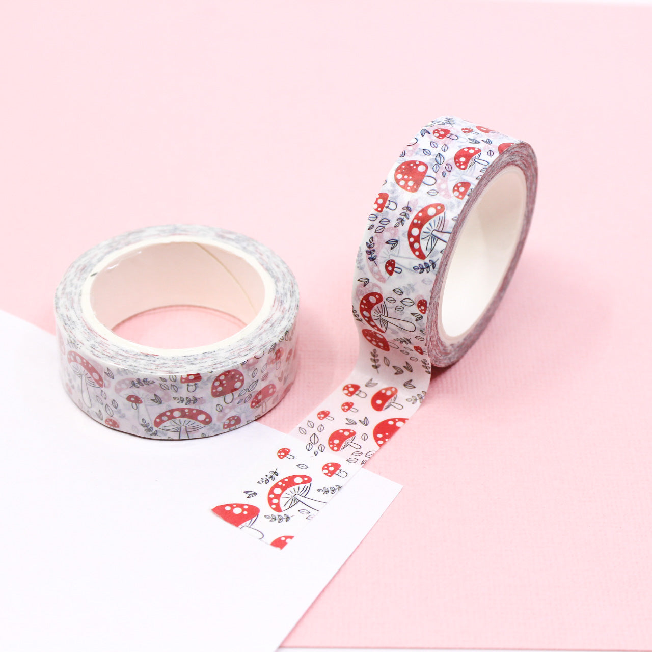 This playful washi tape features a fun pattern of red mushrooms, adding a whimsical touch to your crafting projects. Perfect for scrapbooking, journaling, or adding a pop of color to any creative endeavor. This tape is sold at BBB Supplies Craft Shop.