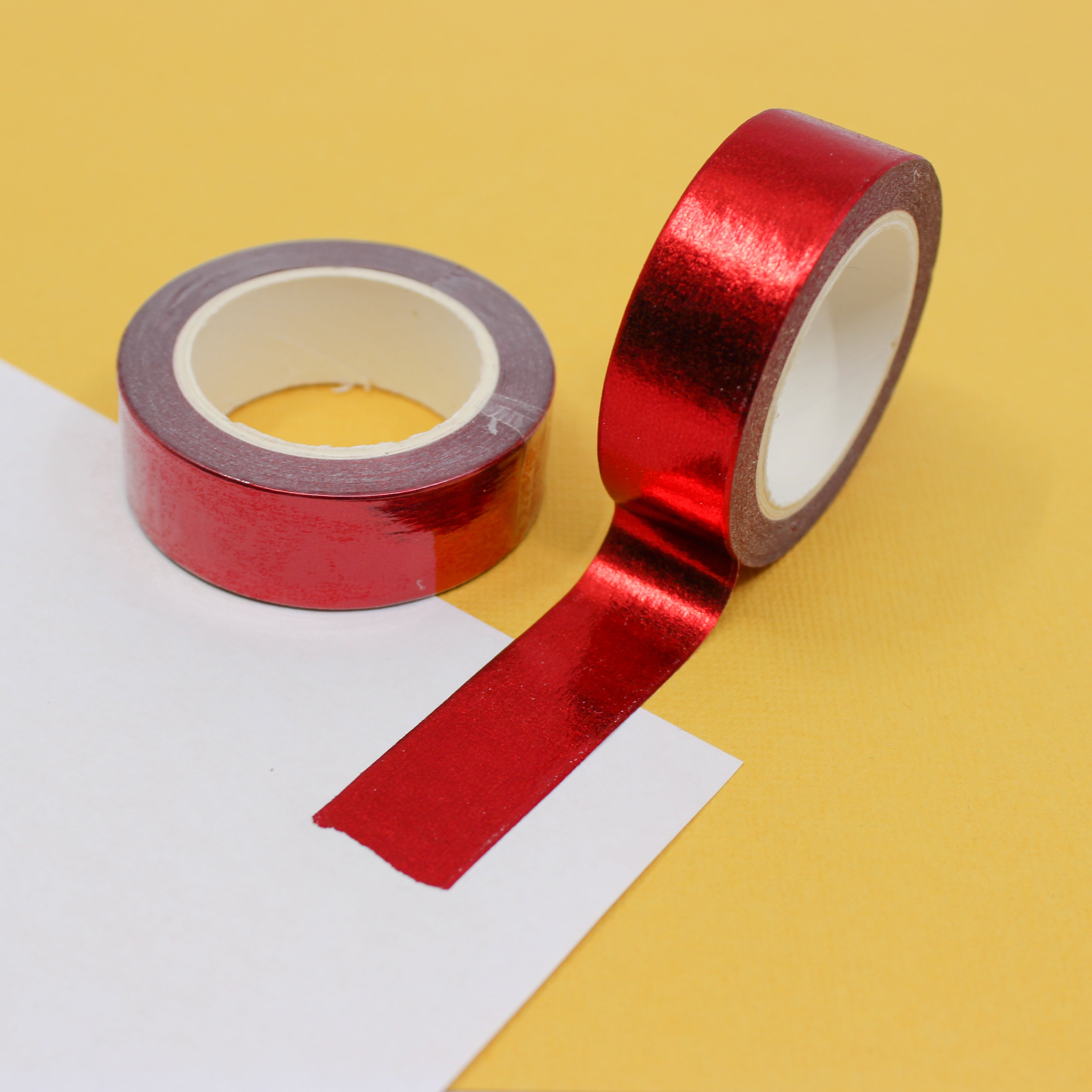 Add a touch of elegance to your crafts with our dazzling red foil washi tape, featuring a shimmering metallic finish that catches the light. This tape is sold at BBB Supplies Craft Shop.