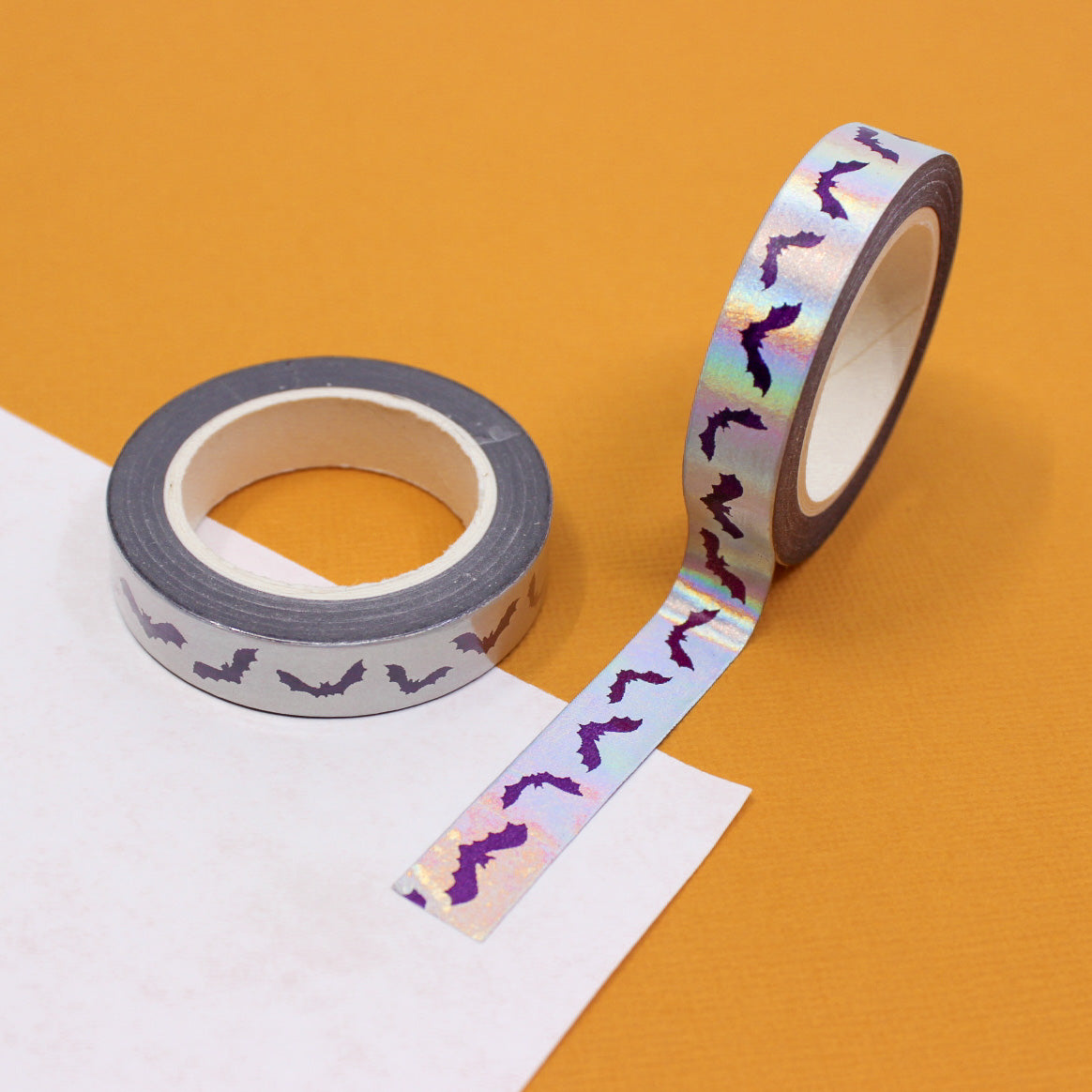 Get in the Halloween spirit with our Silver Foil Spooky Bats Washi Tape, featuring a haunting pattern of bats in shimmering silver foil. Ideal for adding a spooky and stylish touch to your projects. This tape is sold at BBB Supplies Craft Shop.