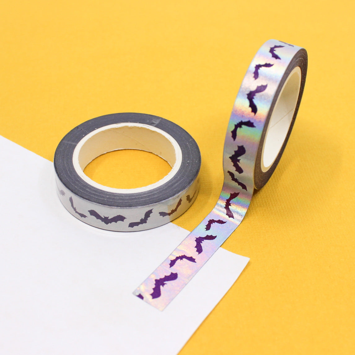 Get in the Halloween spirit with our Silver Foil Spooky Bats Washi Tape, featuring a haunting pattern of bats in shimmering silver foil. Ideal for adding a spooky and stylish touch to your projects. This tape is sold at BBB Supplies Craft Shop.