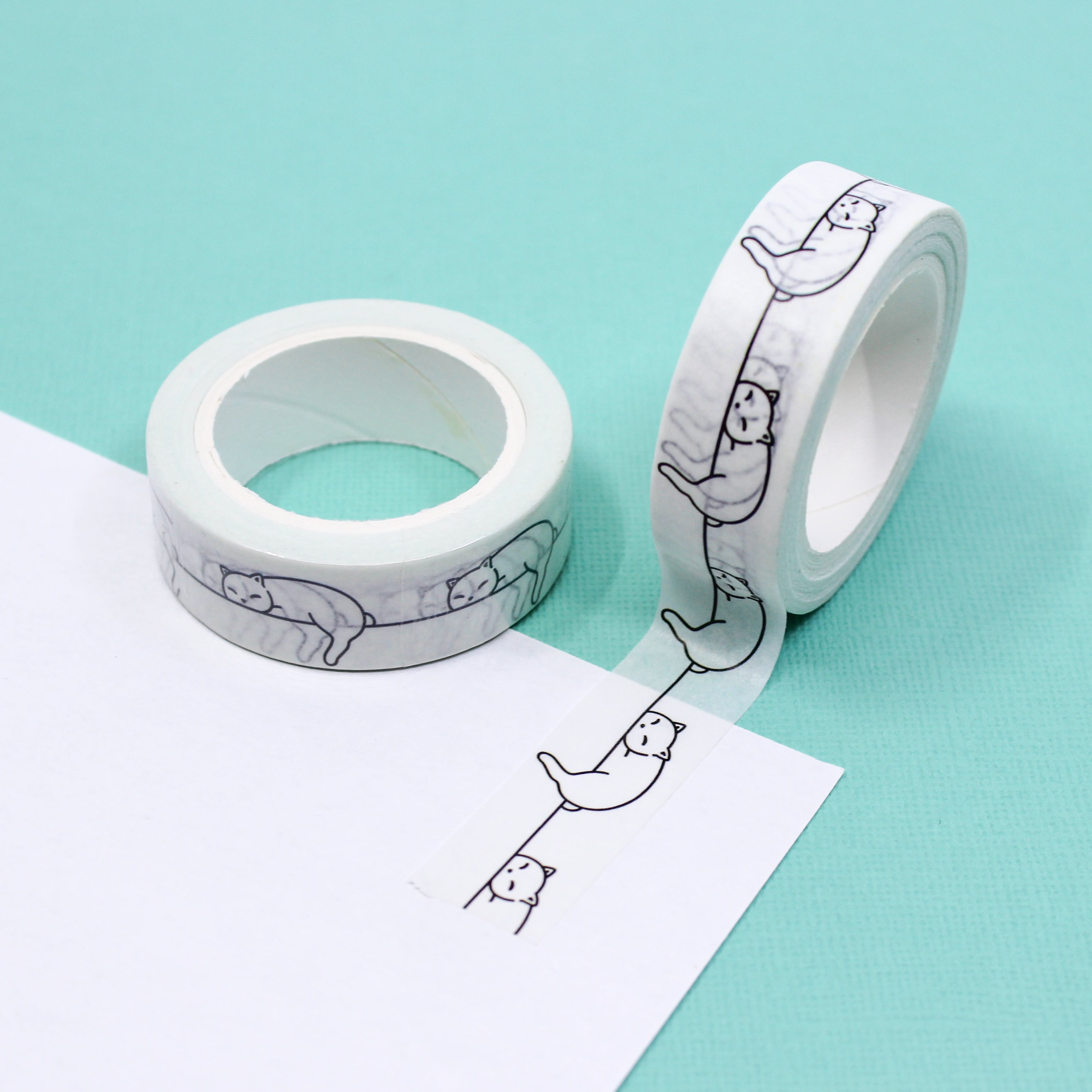 Embrace coziness and charm with our Sleeping Cat Washi Tape, featuring adorable cat illustrations. Ideal for adding a touch of feline sweetness to your projects. This tape is sold at BBB Supplies Craft Shop.