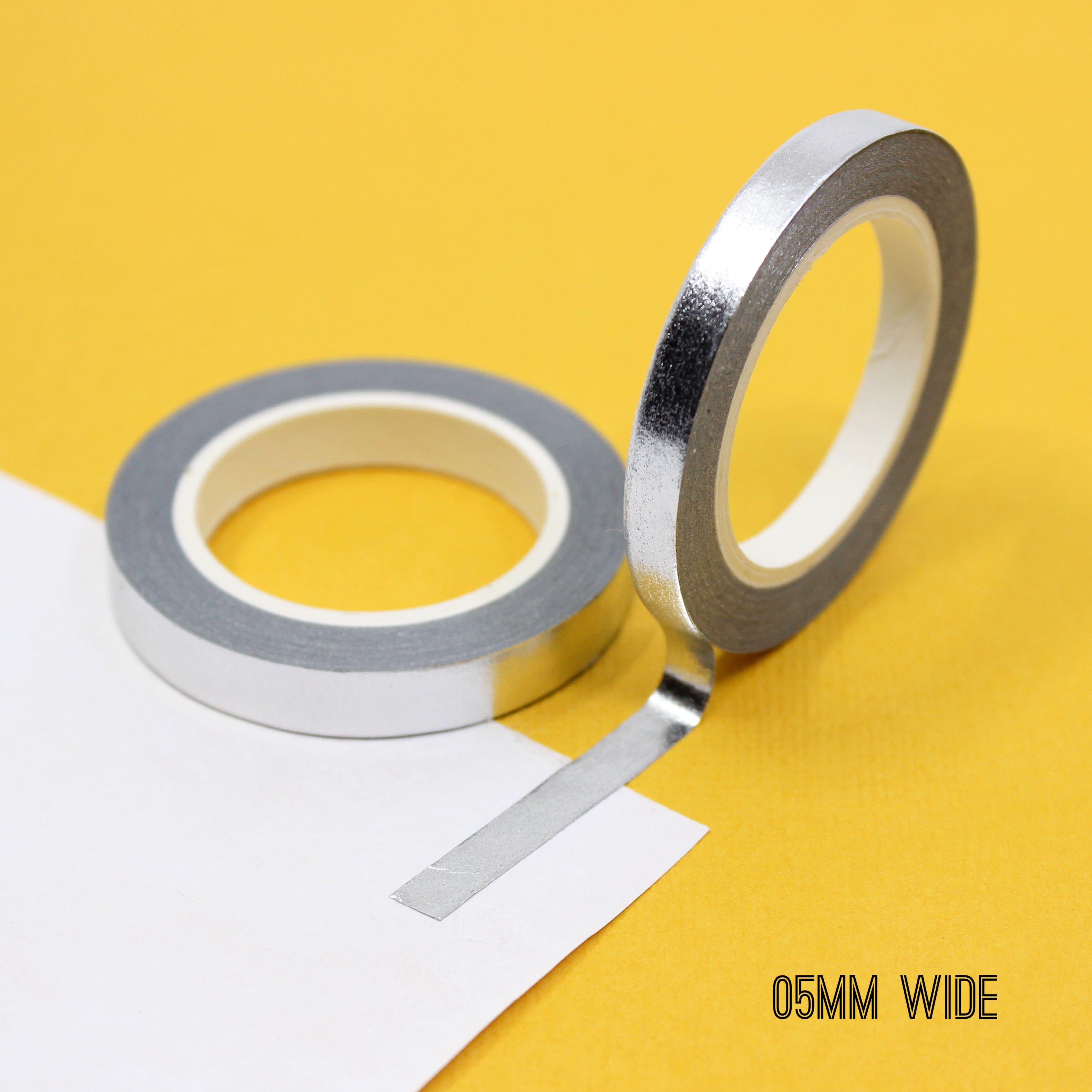 Infuse your projects with a shimmering elegance using our solid foil silver washi tape, adorned with a lustrous and reflective silver foil, creating a striking and eye-catching effect. This tape is sold exclusively at BBB Supplies Craft Shop.