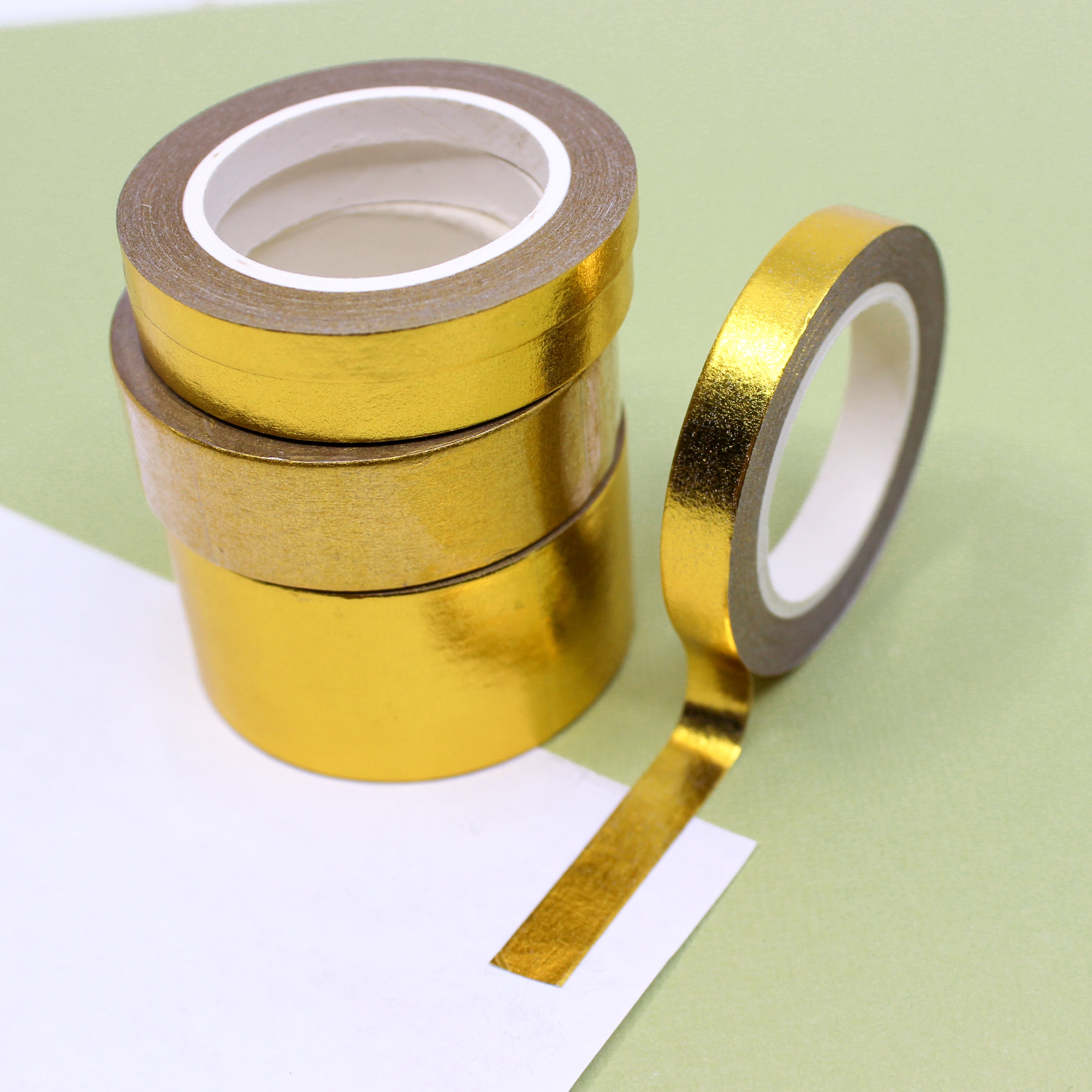 Elevate your creations with our captivating solid foil gold washi tape, showcasing a smooth and shiny surface in a radiant gold color, perfect for adding a touch of opulence and sophistication. These solid foil tapes are sold exclusively at BBB Supplies Craft Shop.