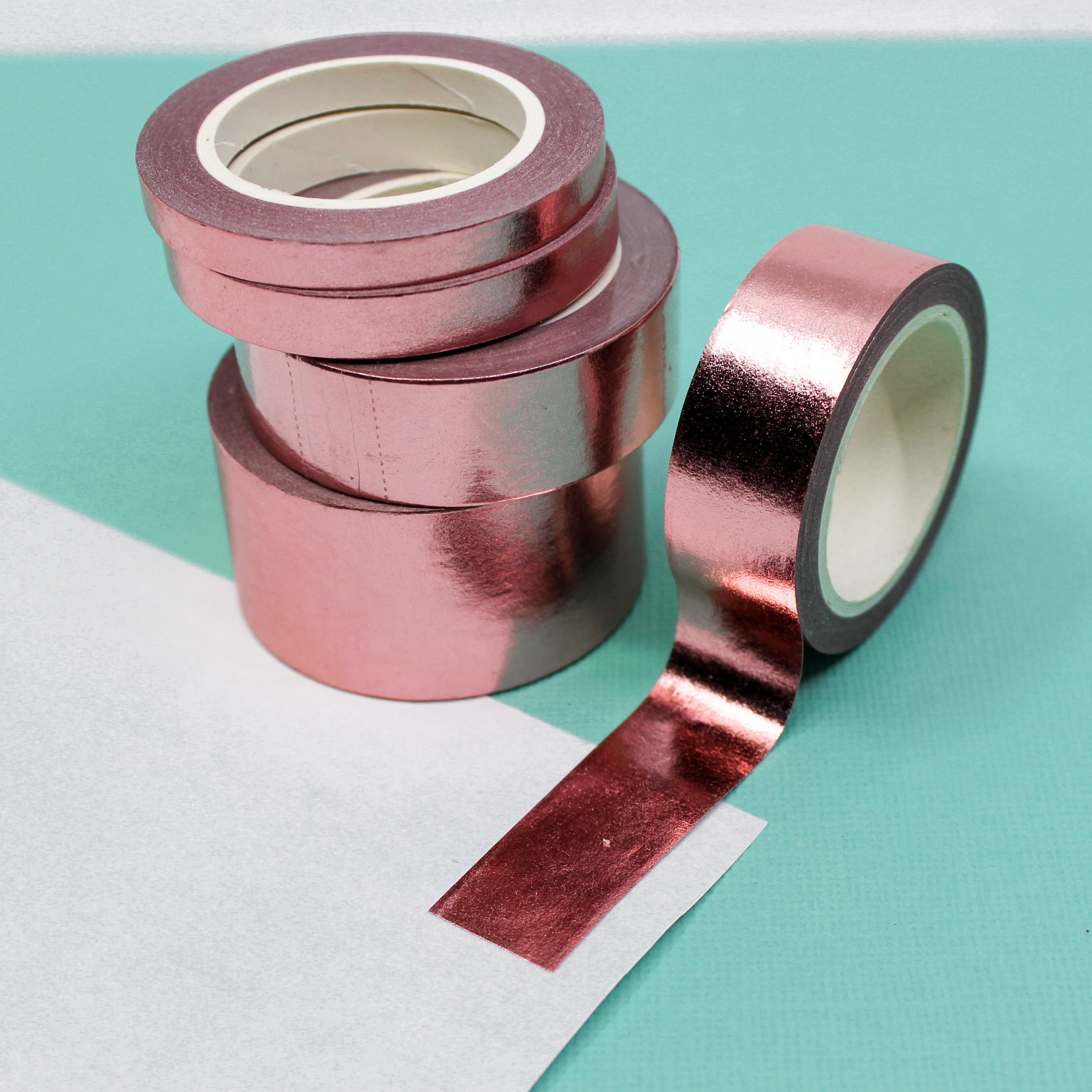 Elevate your creations with our captivating solid foil rose gold washi tape, showcasing a smooth and shiny surface in a radiant gold color, perfect for adding a touch of opulence and sophistication. This tape is sold exclusively at BBB Supplies Craft Shop.