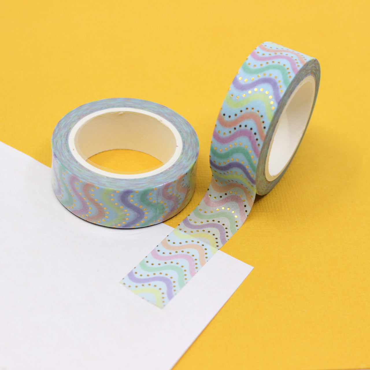 Add a vibrant and dynamic touch to your projects with this colorful rainbow swivel chevron washi tape. Perfect for adding a playful and stylish element to your crafts, journals, and more. This tape is sold at BBB Supplies Craft Shop.