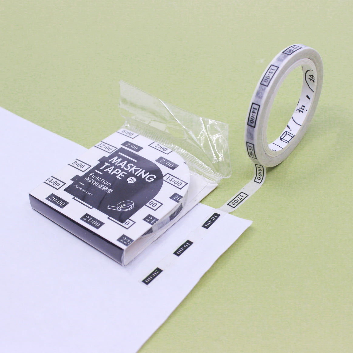 Minimalist time-blocking washi tape roll displayed upright beside its original box.