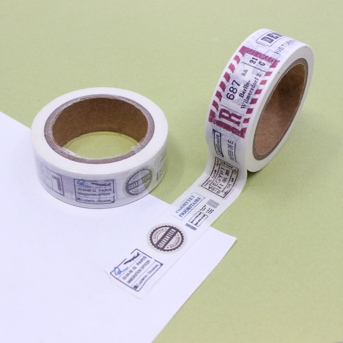 Passport Travel Stamps Washi Tape featuring a collage of vintage passport stamps from around the world, perfect for globetrotters. This tape is sold at BBB Supplies Craft Shop.