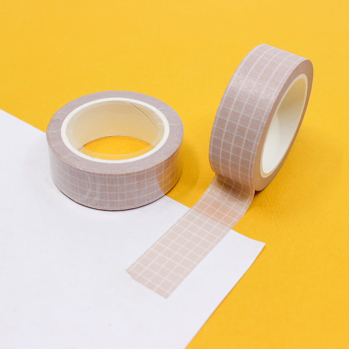 Soft neutrals grid washi tape in shades of soft pink, blush, light tan, and brown, featuring a minimalist grid pattern perfect for elegant and organized crafts.