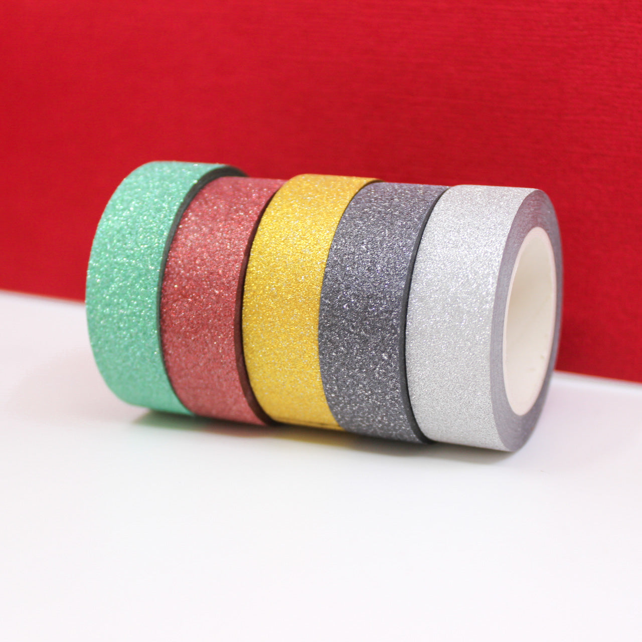 Add sparkle and shine to your winter crafts with these glitter tapes. Perfect for adding a festive touch to cards, scrapbooks, or gift wrapping. These glitter tapes are sold in green, black, silver, Gold, and Dark Red. You can buy them at BBB Supplies Craft Shop.