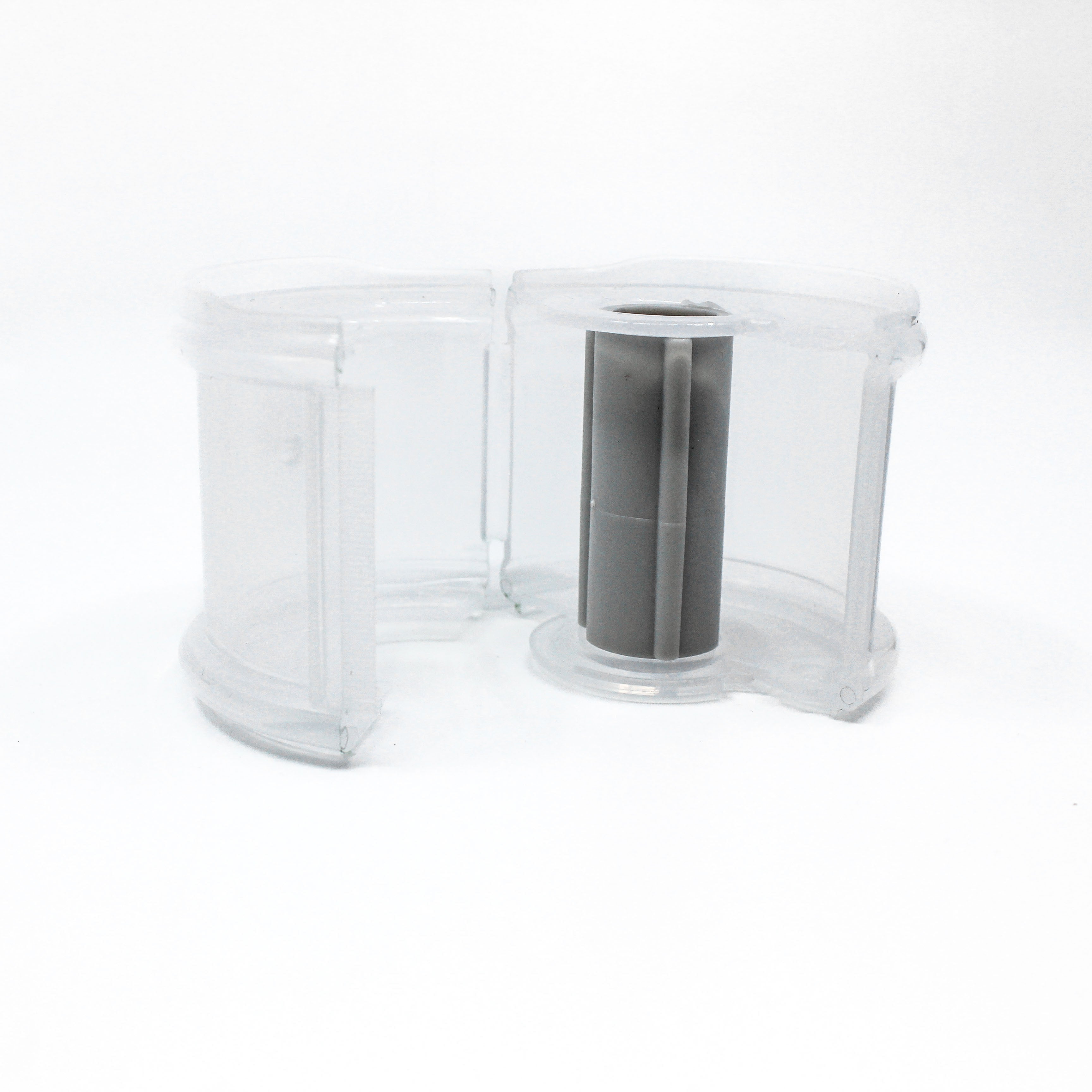 Clear plastic washi tape dispenser container open on a white background