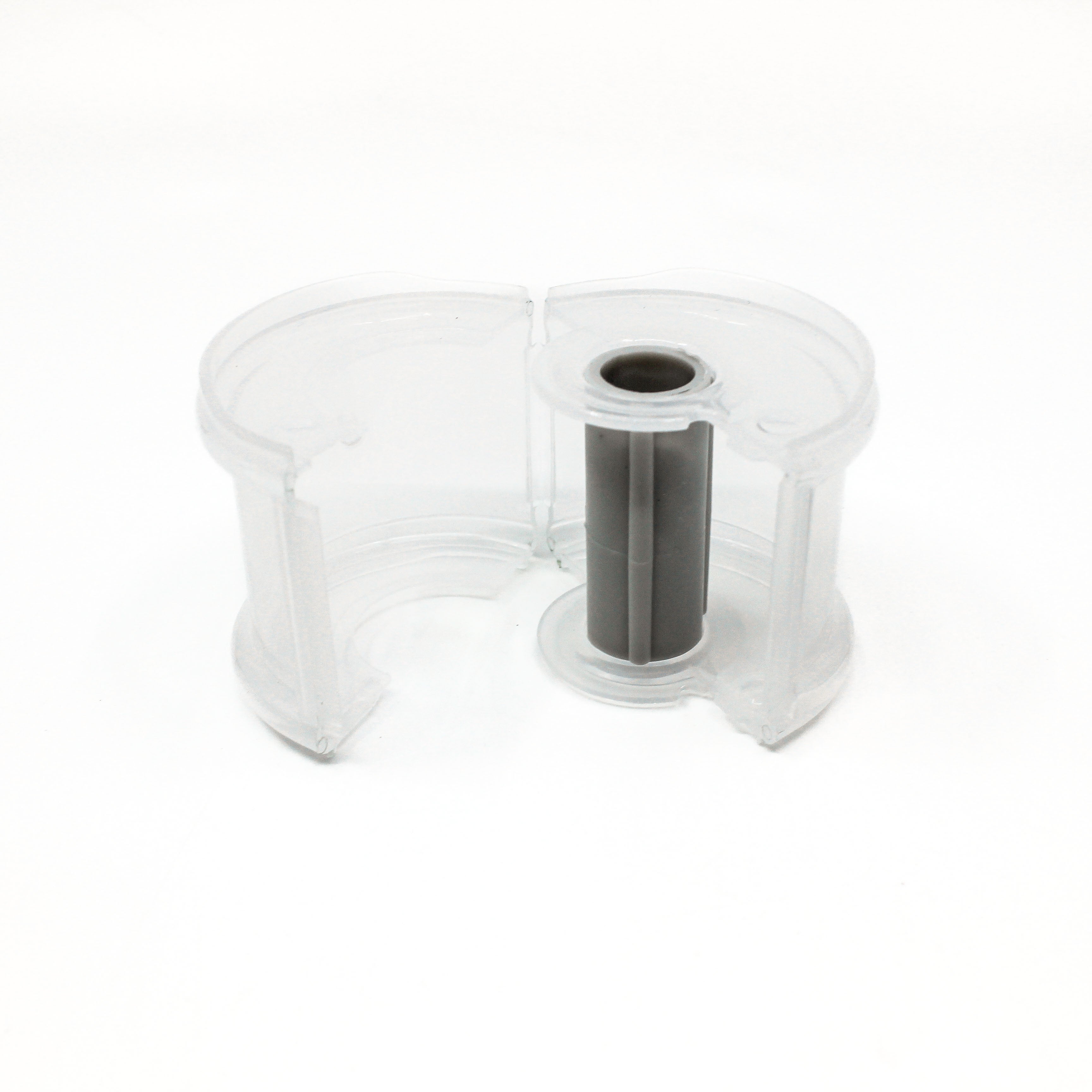 Clear plastic container with a central cylindrical component on a white background