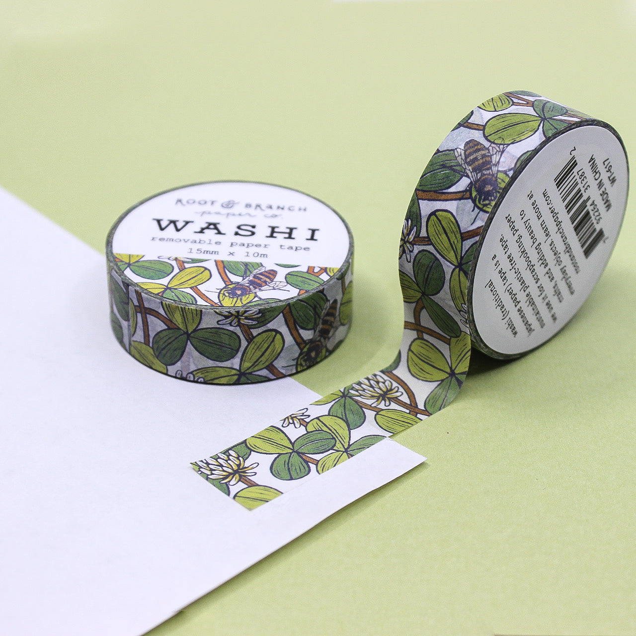 This White Clover Bee washi tape, featuring intricate illustrations of bees buzzing around delicate white clover flowers, this charming washi tape is perfect for adding a touch of whimsy and elegance to your planners, journals, or scrapbooks.